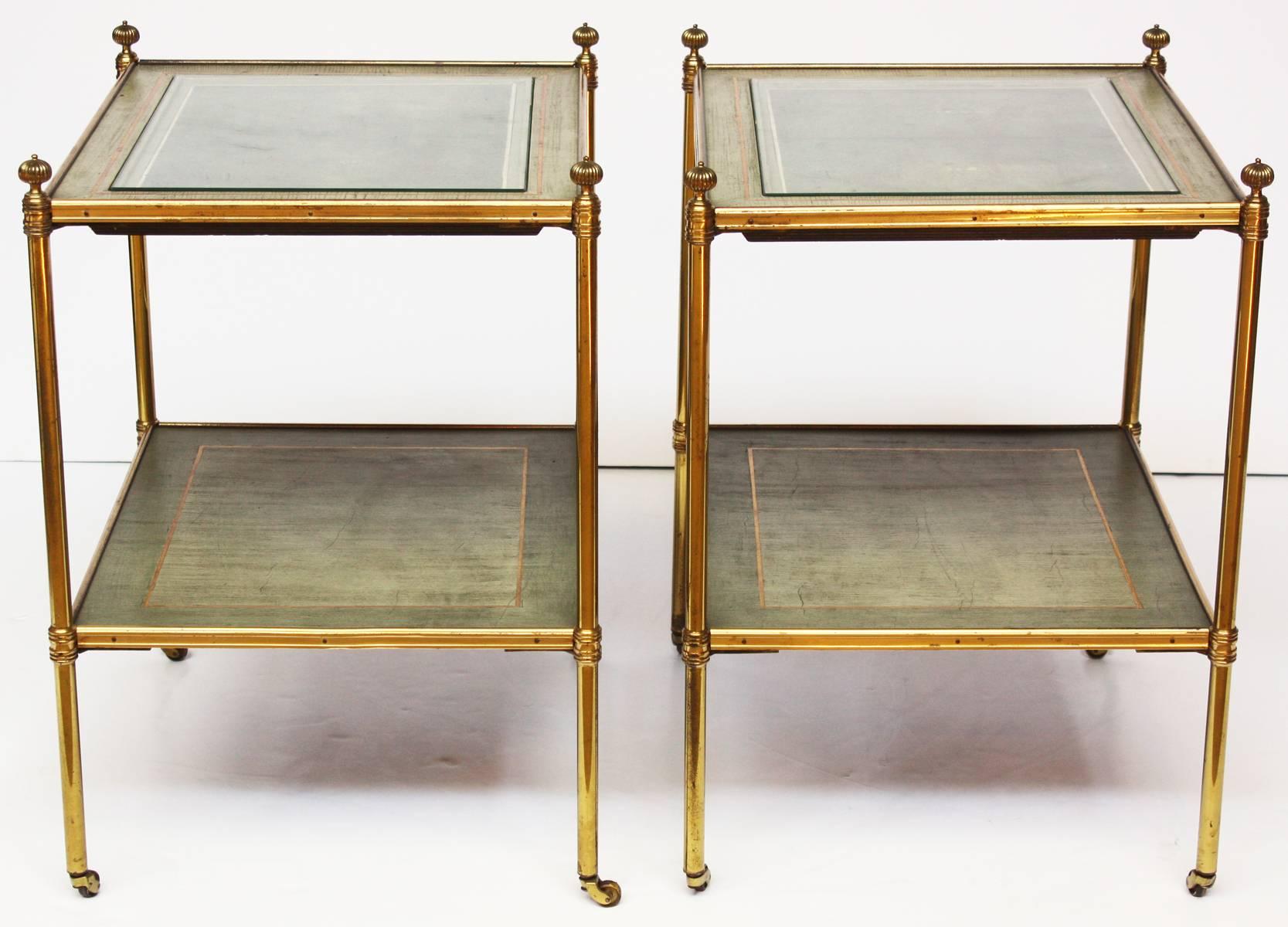 Pair of Baguès side tables featuring inset bookmatched shagreen under glass with parchment and gilt banded border, over a matching parchment with gilt band shelf stretcher, in brass frames with short legs resting on casters, circa 1945.