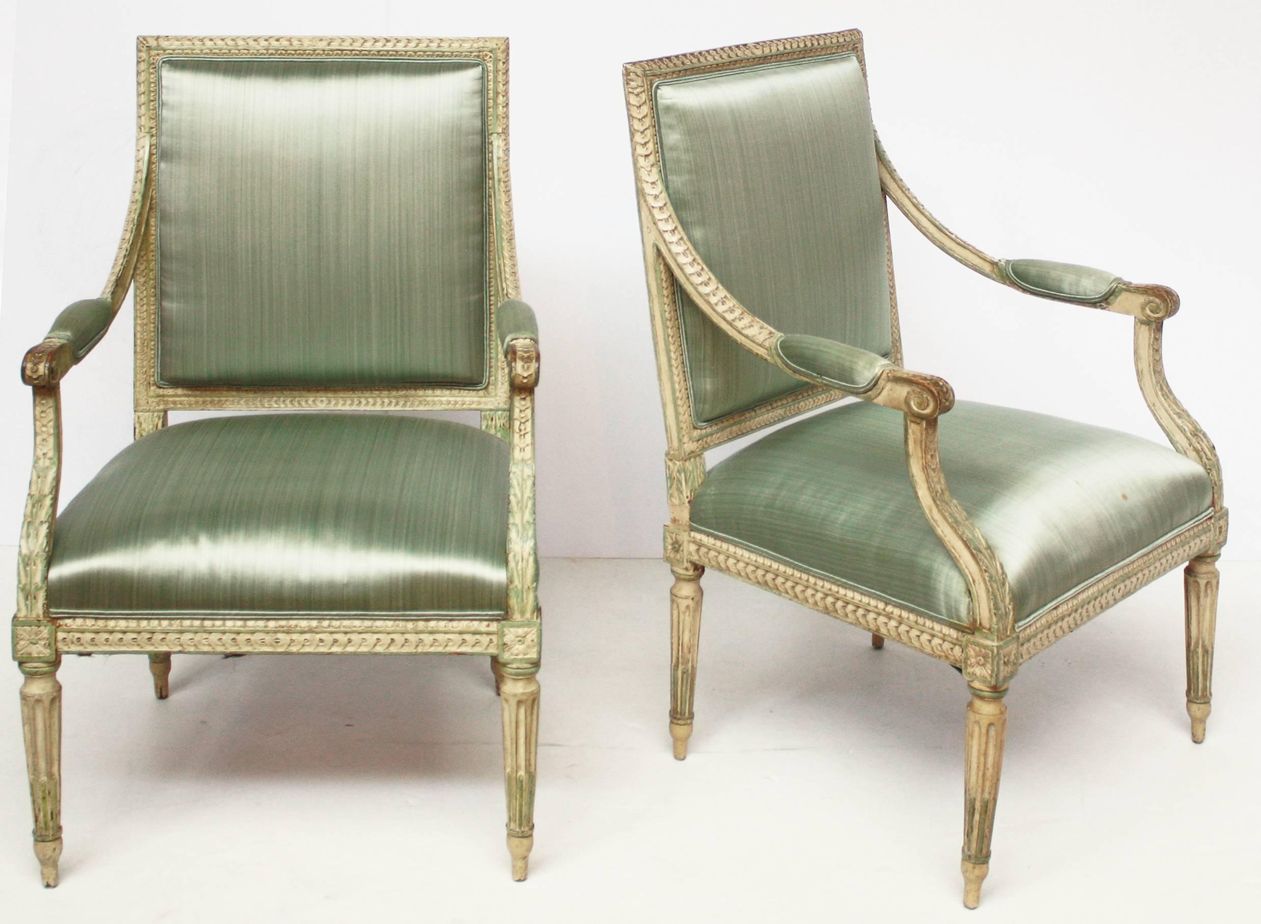 A group of four carved and painted open-armchairs / fauteuils, Louis XVI / neoclassical, circa 1790, with mint green-blue silk upholstery.Possibly Swedish

$5,850.00 per pair. Will sell as pairs.

