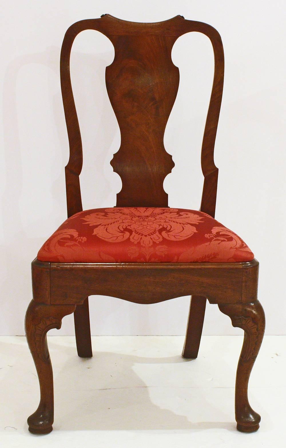 Set of five late George II or early George III mahogany side chairs with slip seats upholstered in crimson silk damask, shaped crest rail and stiles, vasiform splat, splayed rear legs and shaped cabriole front legs with pad feet.
