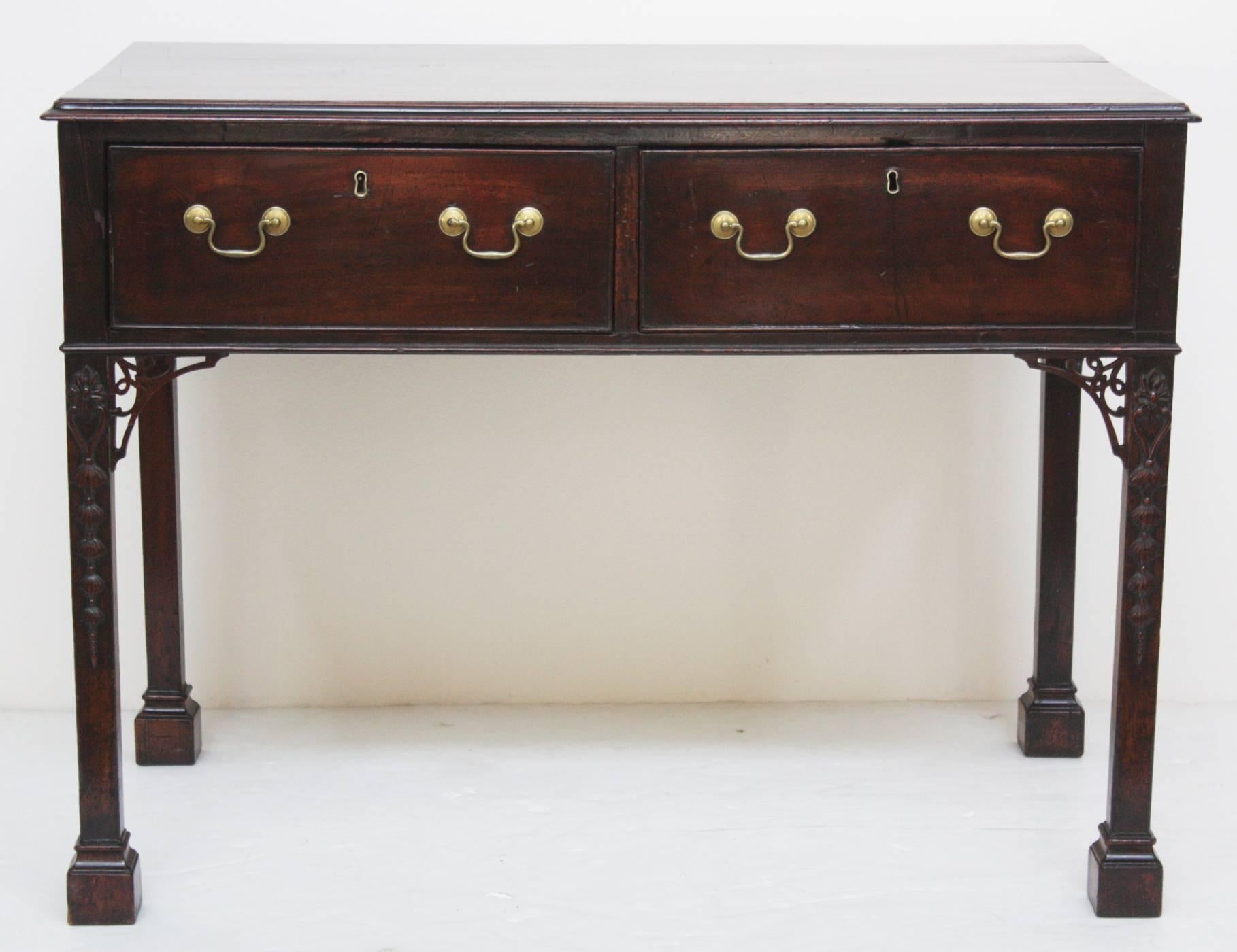 Period Georgian, handsome Chippendale style serving table, mahogany case with two (2) generous cockbeaded drawers with locks (one missing / No Key), each with two brass bale handles and keyhole escutcheons, straight Marlborough legs with open