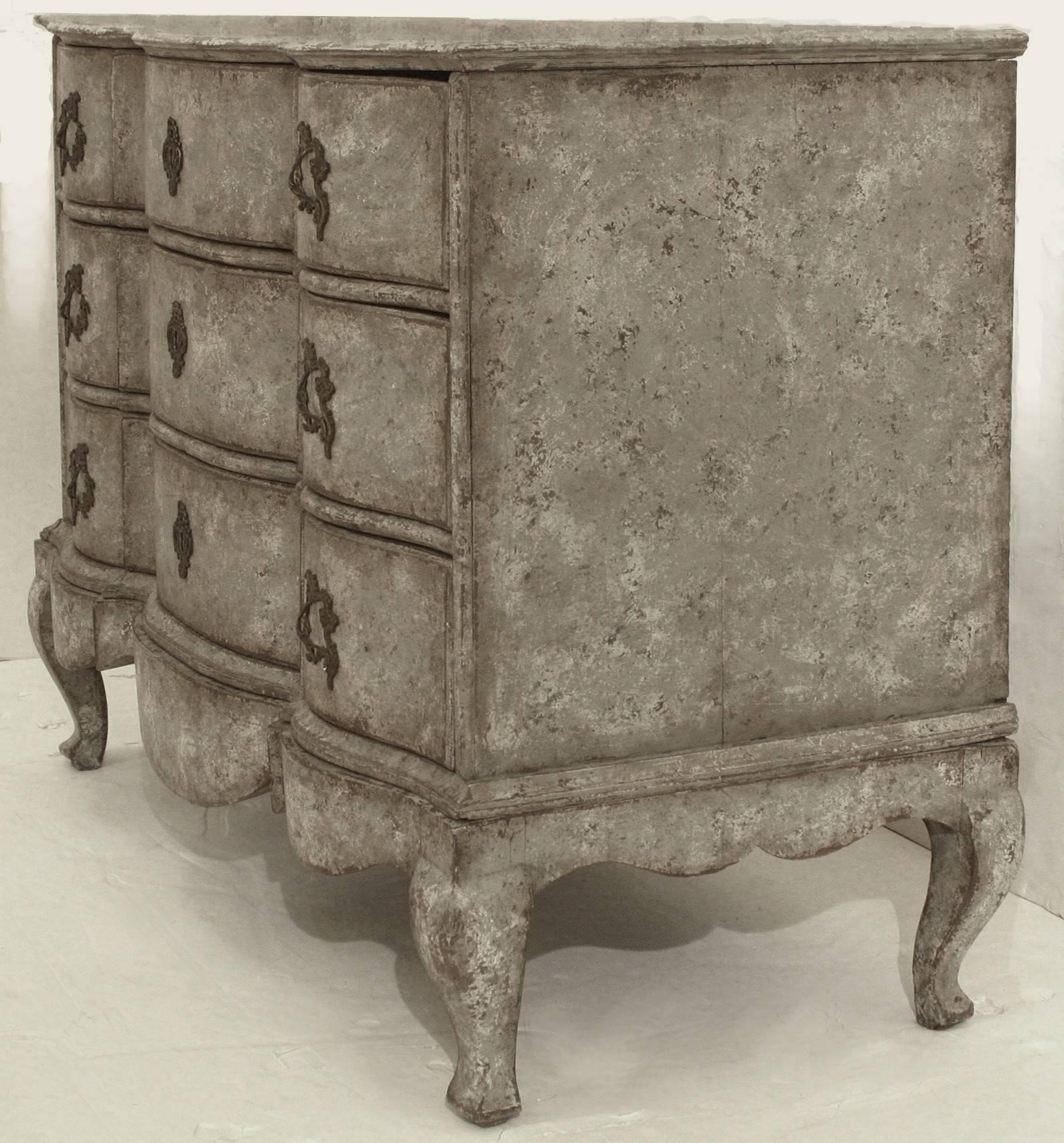 Rococo period commode with serpentine front and cabriole legs. Beautiful and weathered original brass hardware and paint.