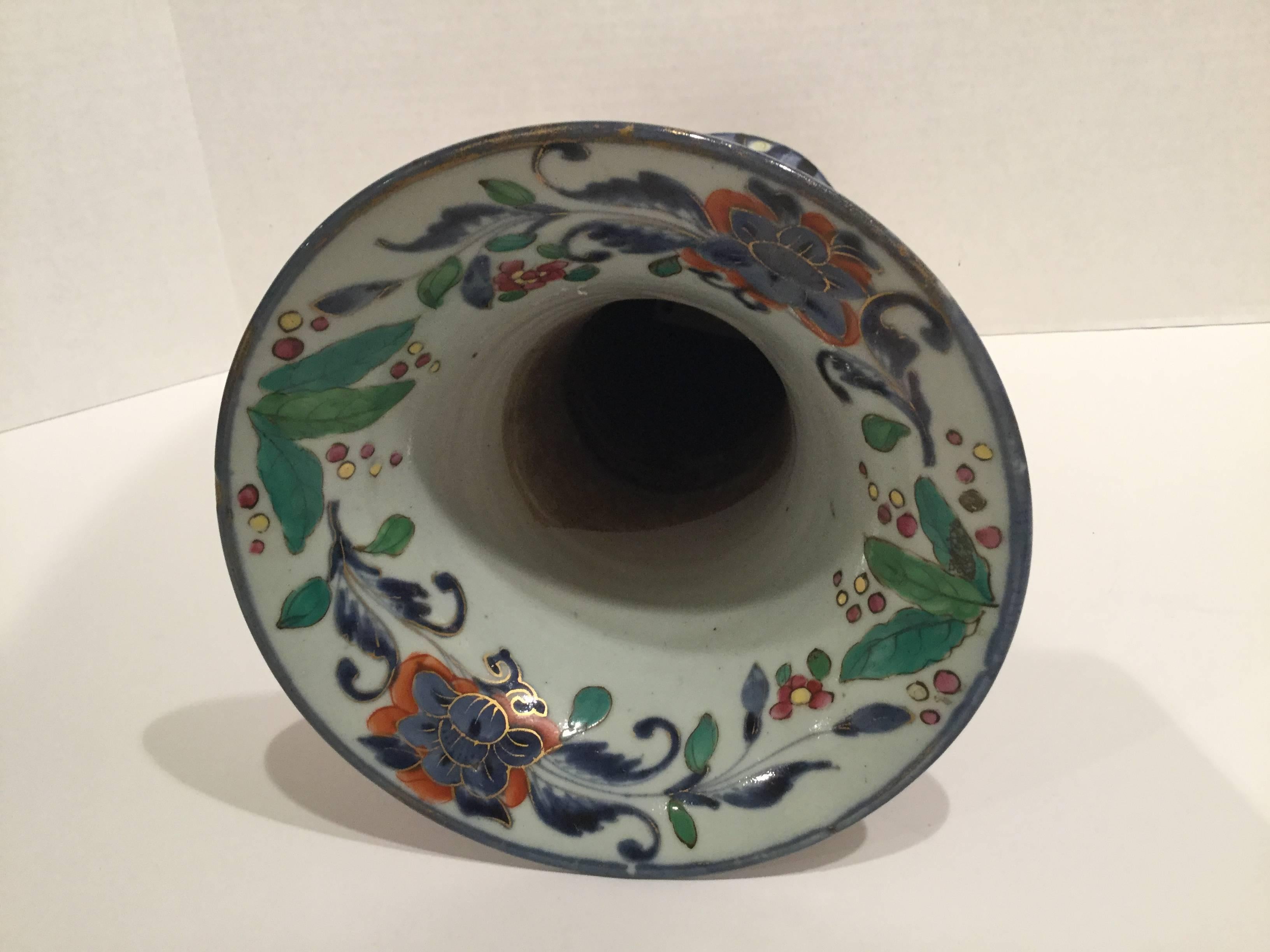Clobbered Japanese Arita vase decorated with a floral design.
