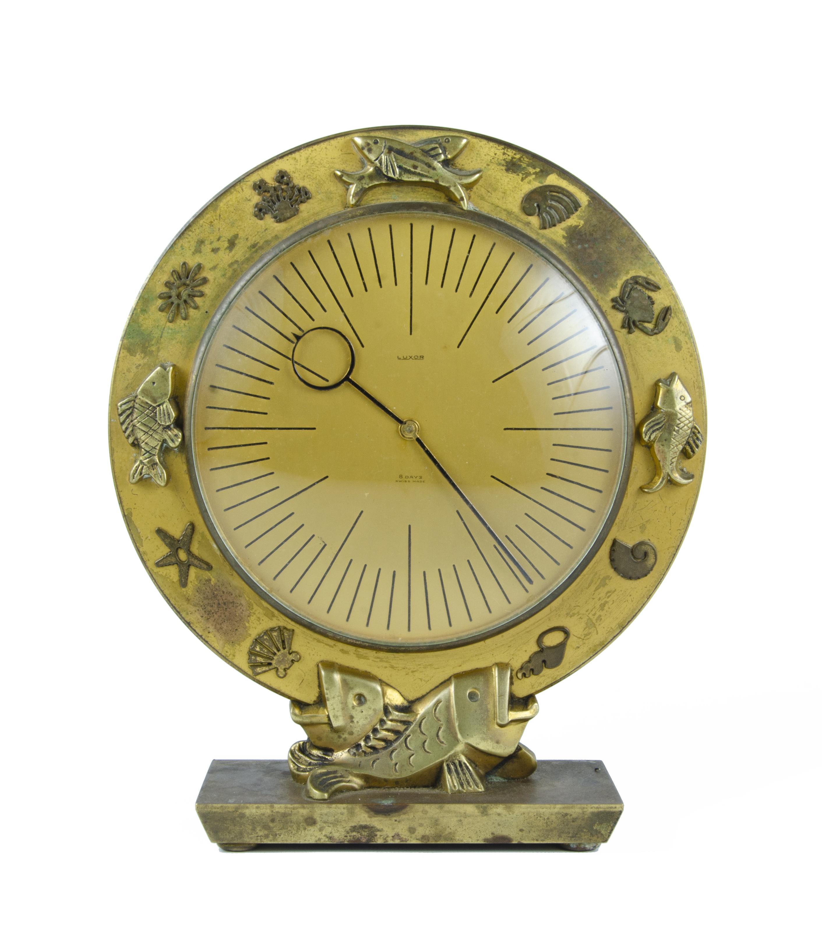 Mid-20th Century Modern Luxor Swiss 8-day movement bronze table clock with marine motif

By: Luxor
Material: bronze, copper, metal, glass, crystal
Technique: cast, molded, metalwork, polished
Dimensions: 2.5 in x 5.5 in x 9.5
Date: mid-20th