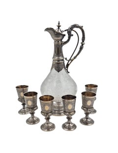Set di fine XIX secolo composto da caraffa in argento 800 e cristallo con sei calici, Germania