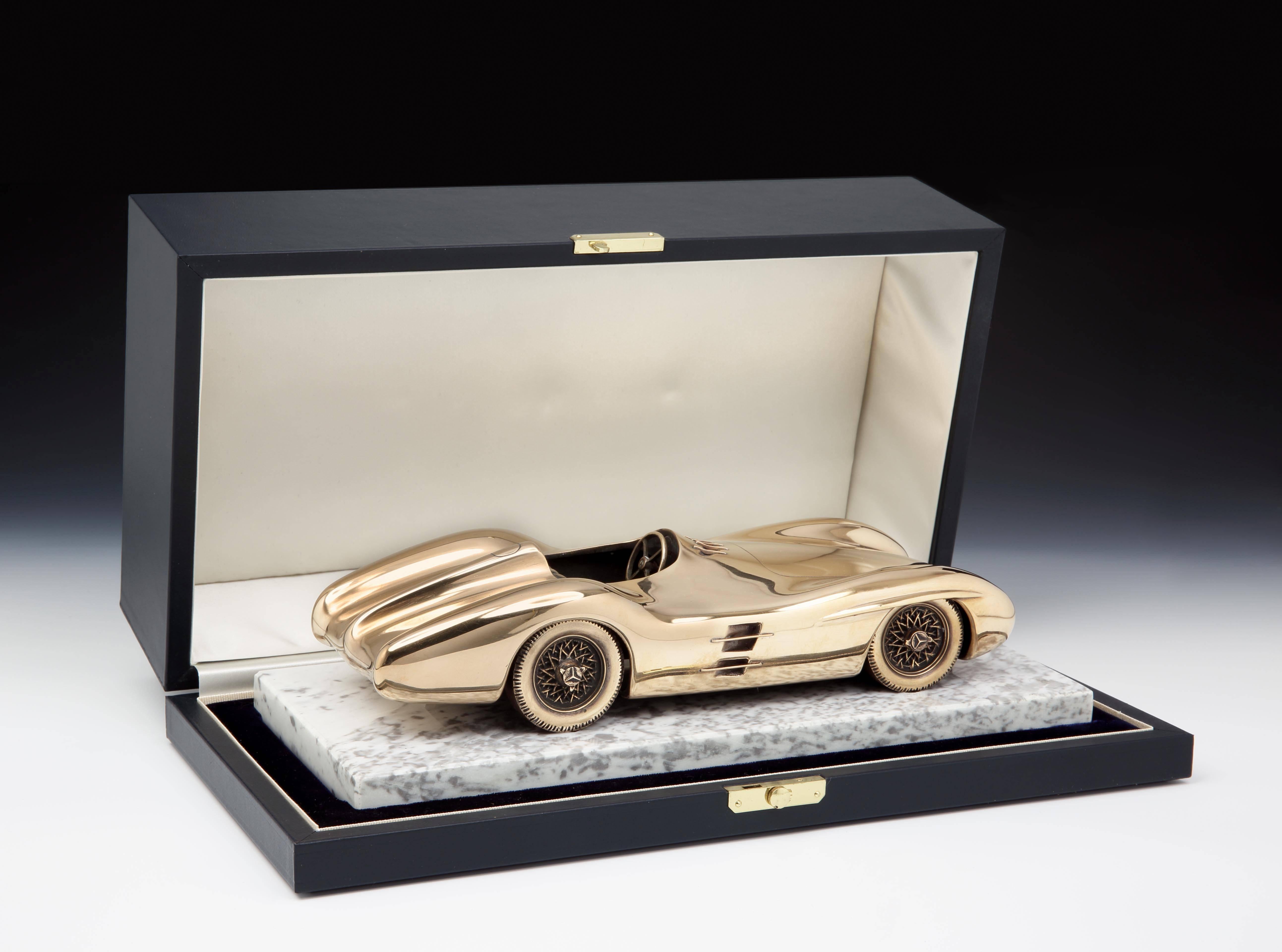 Mercedes-Benz Typ W196 Streamliner bronze

A fine and important 1955 presentation bronze sculpture in the form of the Mercedes-Benz Typ W196 Grand Prix car (1954-1955), mounted on original white marble plinth with inserted bronze plaque, with
