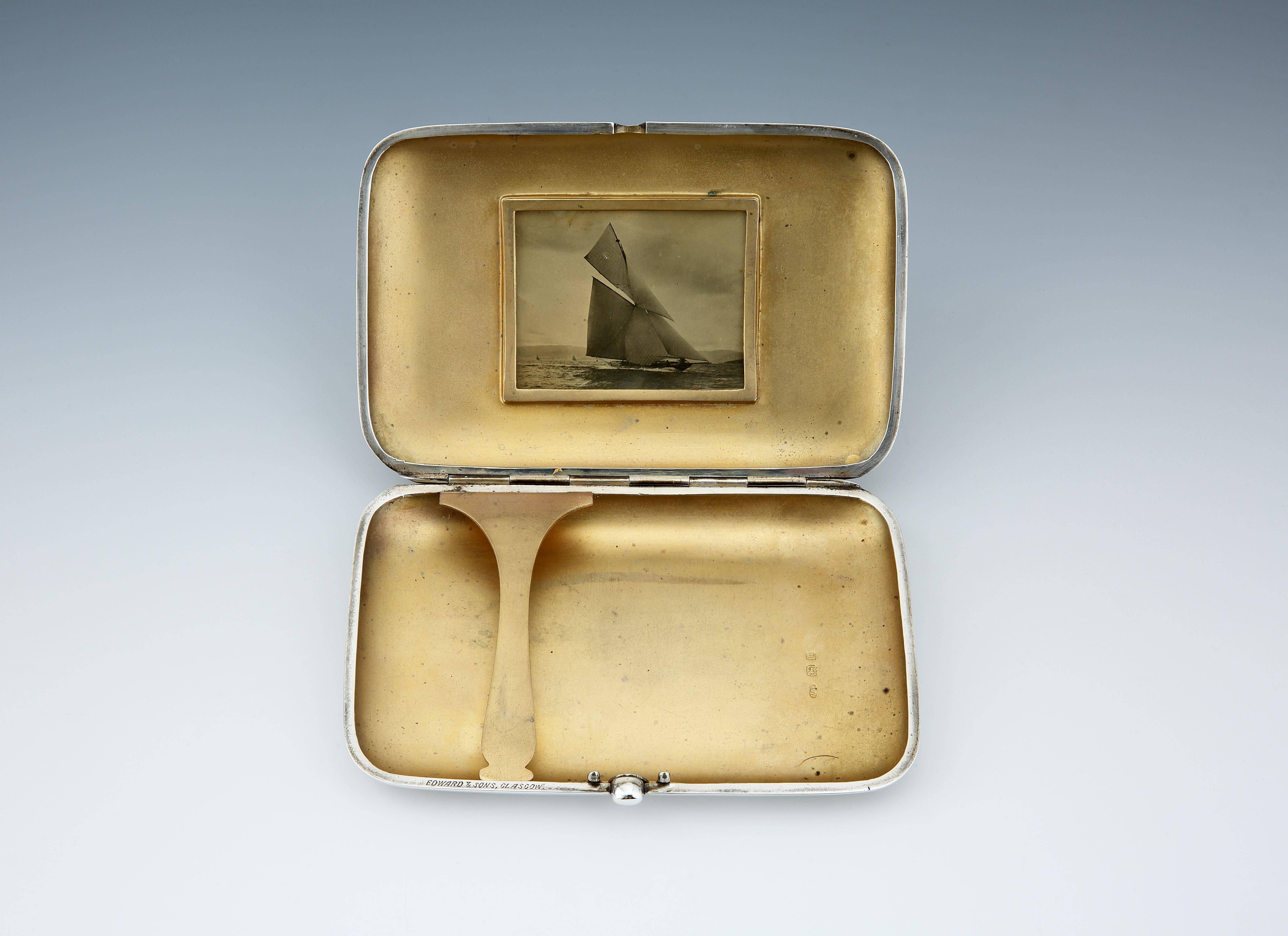 Dragon, 1907: a highly unusual special-commission Sterling silver cigar case of large capacity, the front with an engraved design of a stylized yacht mast, with 13 black and yellow yacht flags, corresponding to Dragon’s designated yacht flag in