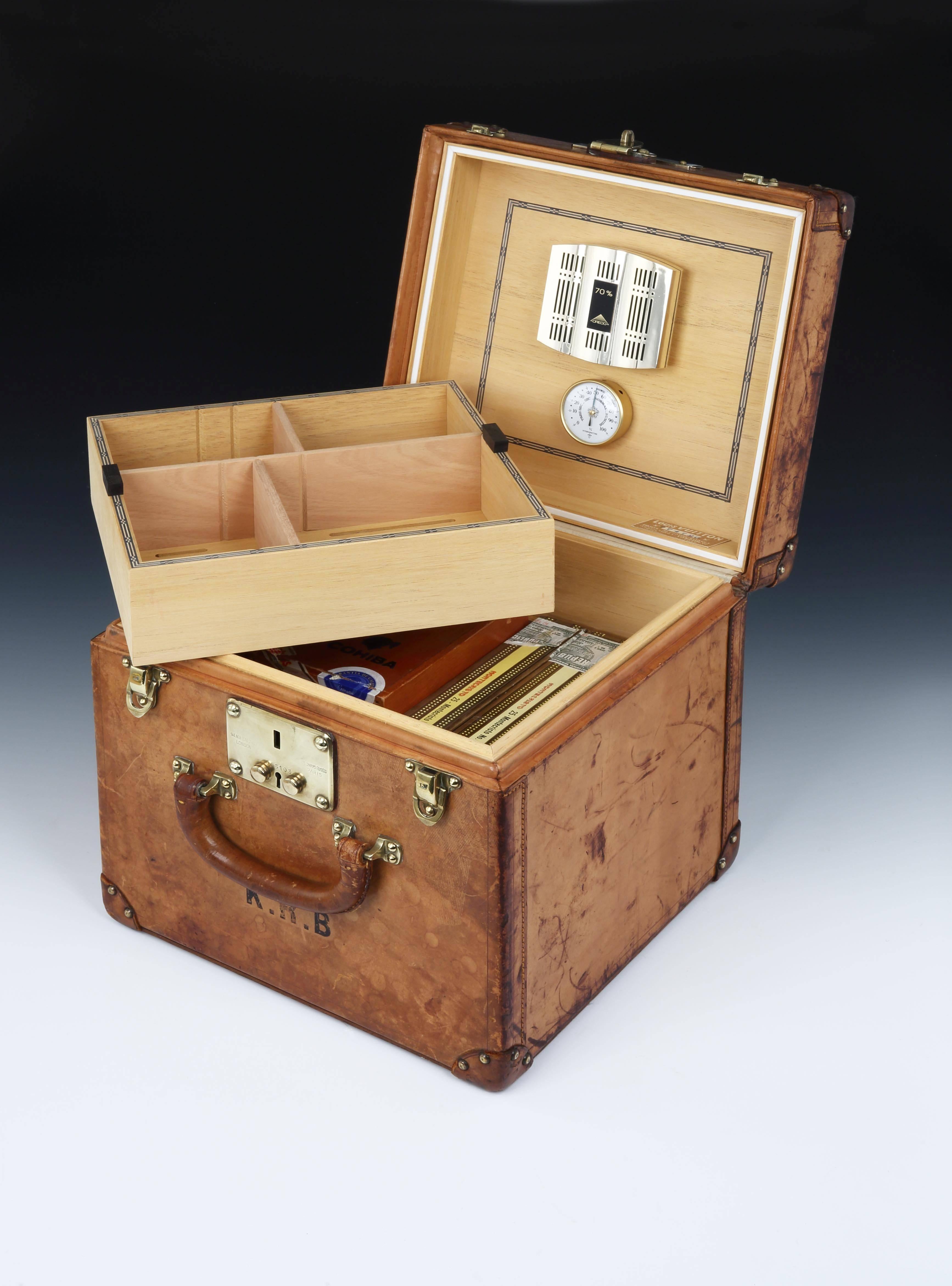 A rare Top Hat trunk in natural leather by Louis Vuitton, complete with leather corners, brass studs, lock and fittings, the interior has been completely and sympathetically relined as a storage humidor, able to take a large quantity of cigars in