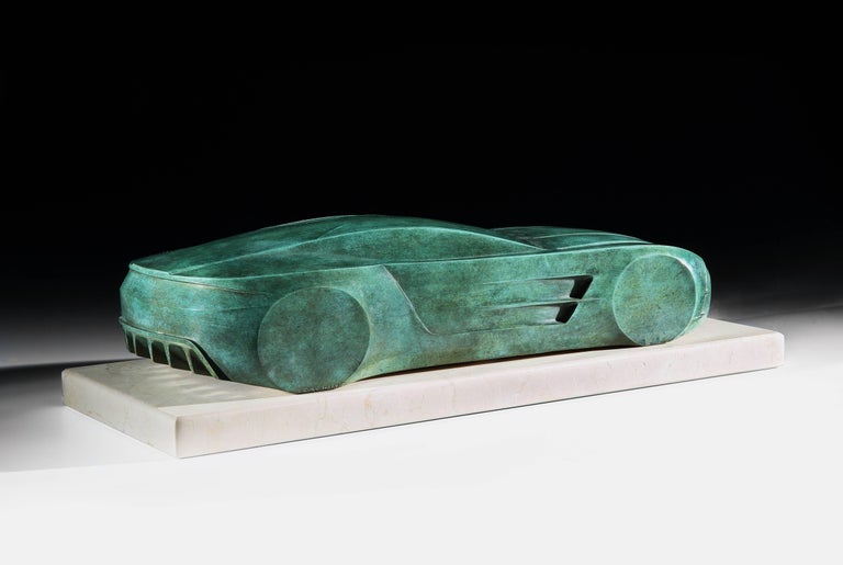 A patinated bronze sculpture of a stylized Aston Martin One-77 by Emmanuel Zurini (French, b.1942), mounted on a honed limestone plinth, with engraved artist’s signature and edition number, 2 of 8, and dated 2009.
The Aston Martin One-77 first