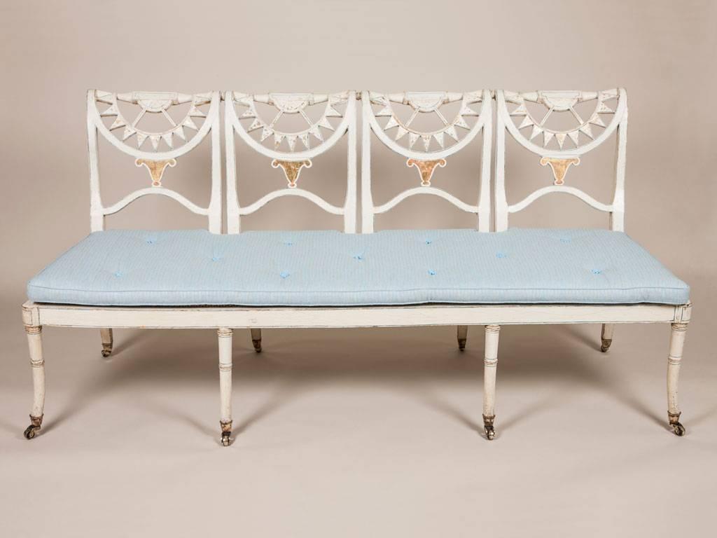 A Regency painted settee with neoclassical decoration, circa 1820.