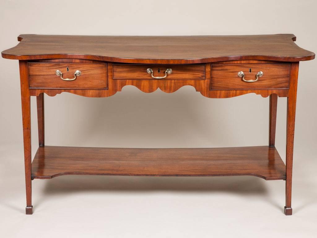 A George III mahogany serving table with an unusual exaggerated serpentine top, circa 1770.
