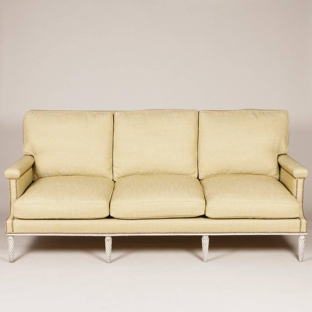A square backed sofa in the Louis XVI style by Maison Jansen, Paris, circa 1950.