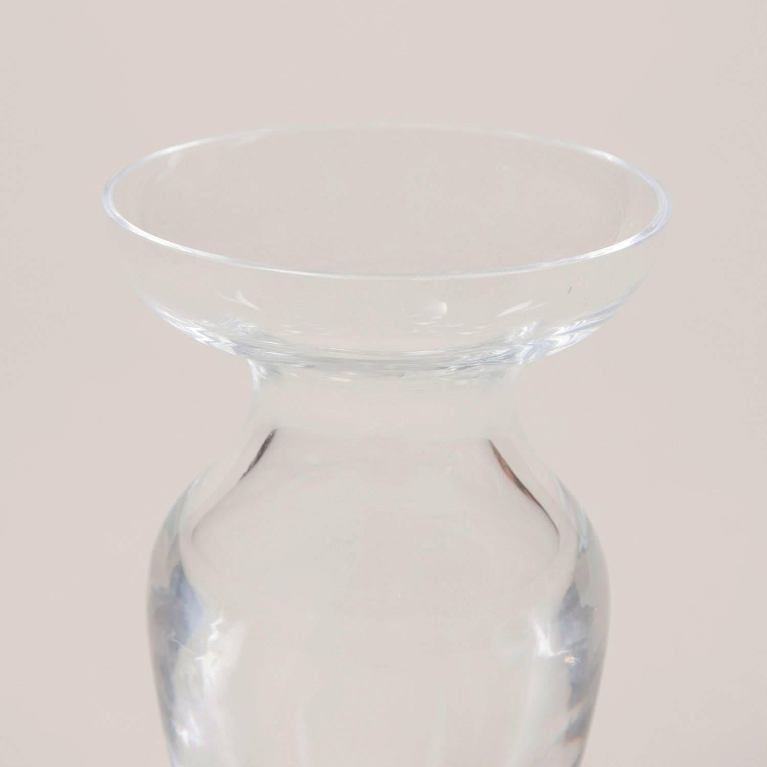 A Colefax and Fowler small urn shaped glass vase.