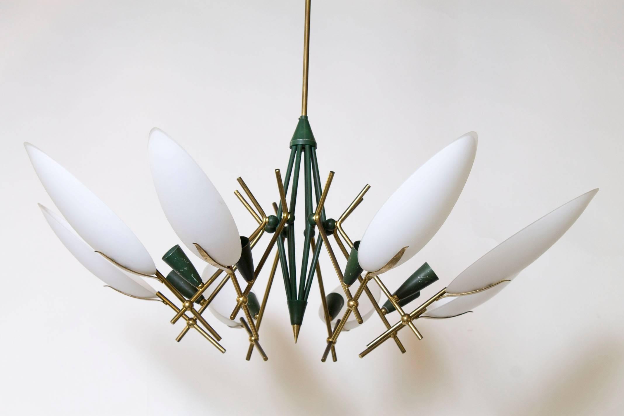 Italian brass and white glass chandelier in the style of Stilnovo. Features brass fittings, frosted white glass shades and canopy brass fittings. Newly rewired for installation USA.