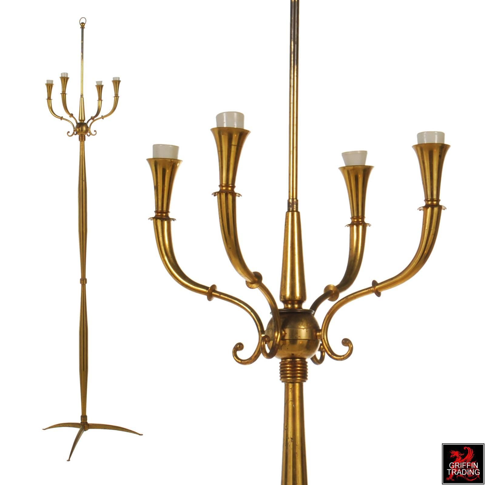 This very stylish 1940s-1950s Italian brass floor lamp has many fine elegant details from top to bottom, especially the fluted arms with scalloped bobeches. The four lights would ideally have had a shade, but you could easily remove the lampshade