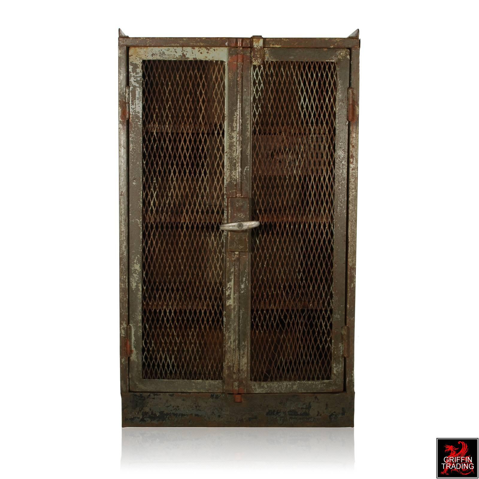 This nice double door steel cabinet is from the French railroad and was used to lock tools and other supplies. The double doors open to three built in shelves and one drawer, perfect for storage. The cabinet has been professional lacquered to keep