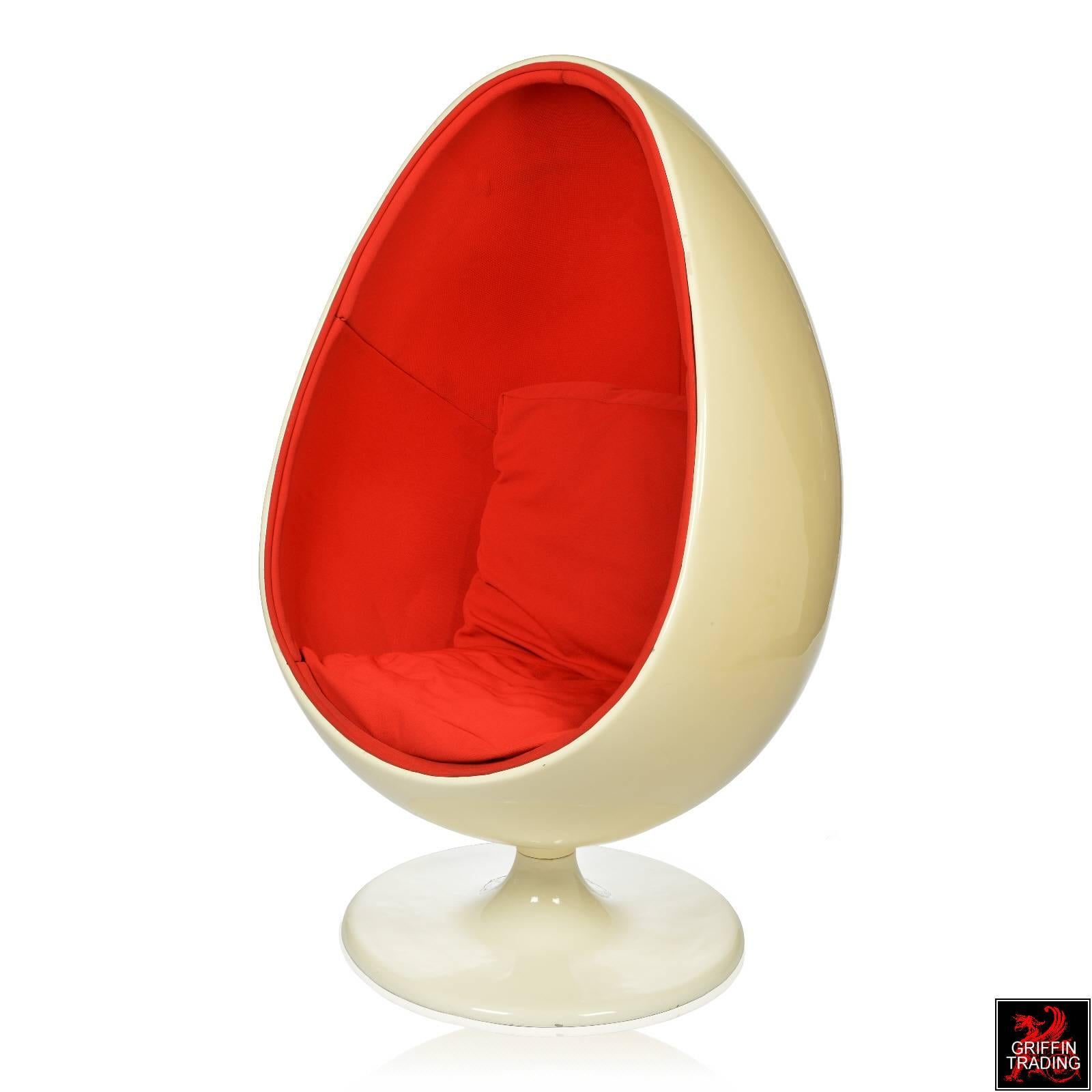 Here it is, the Classic pod chair often referred to as the Egg chair. This is perfect for that Mid-Century modern home or space age home. The orange upholstery has two loose cushions and looks amazing against the off-white color of the egg shaped