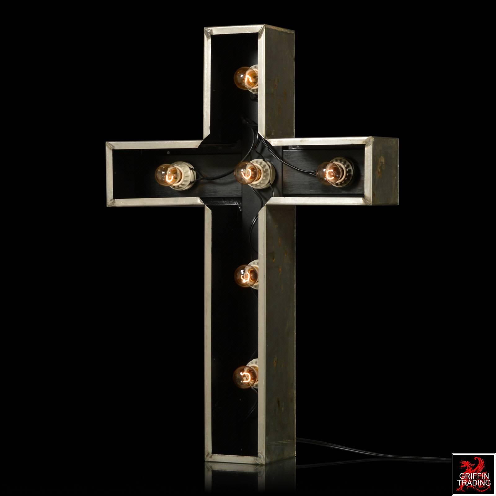 This large lighted cross sign is made of stainless steel and is the first and only one we have ever seen. It was most likely made as a sign for a church or a chapel. Originally there would have been glass or Lucite on the inside front, that would