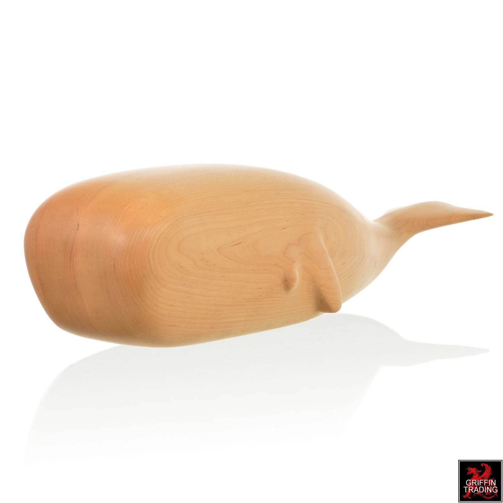 This charming white Whale wood sculpture is the beautiful work of artist and sculptor David Robin Hoyt. The charming design and subtle detail were all hand shaped by the artist. This is a solid sculpture made of layers of thick wood joined together