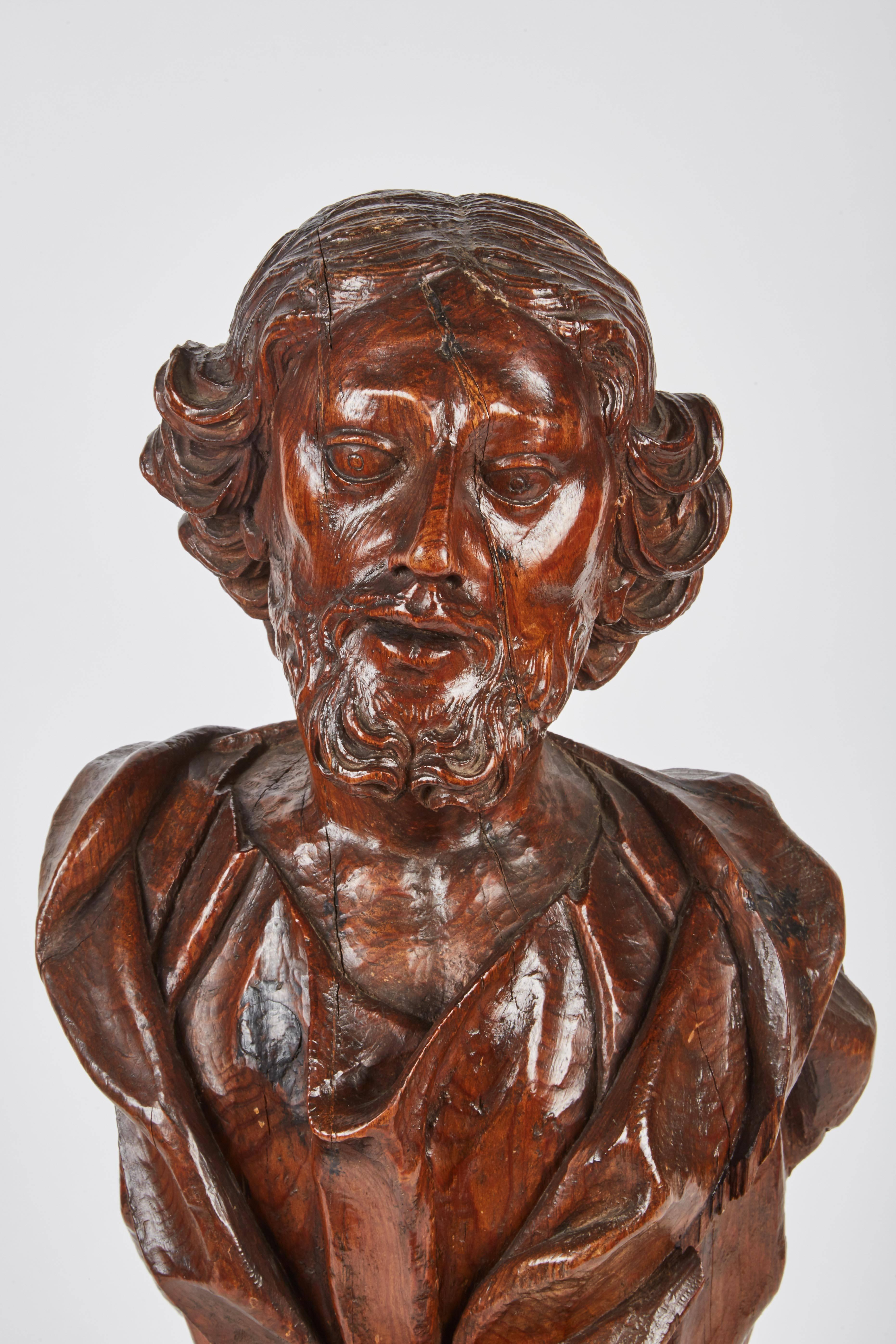 A marvelous bust from circa 1750-1759 Italian Renaissance with drapery and foliage carvings.