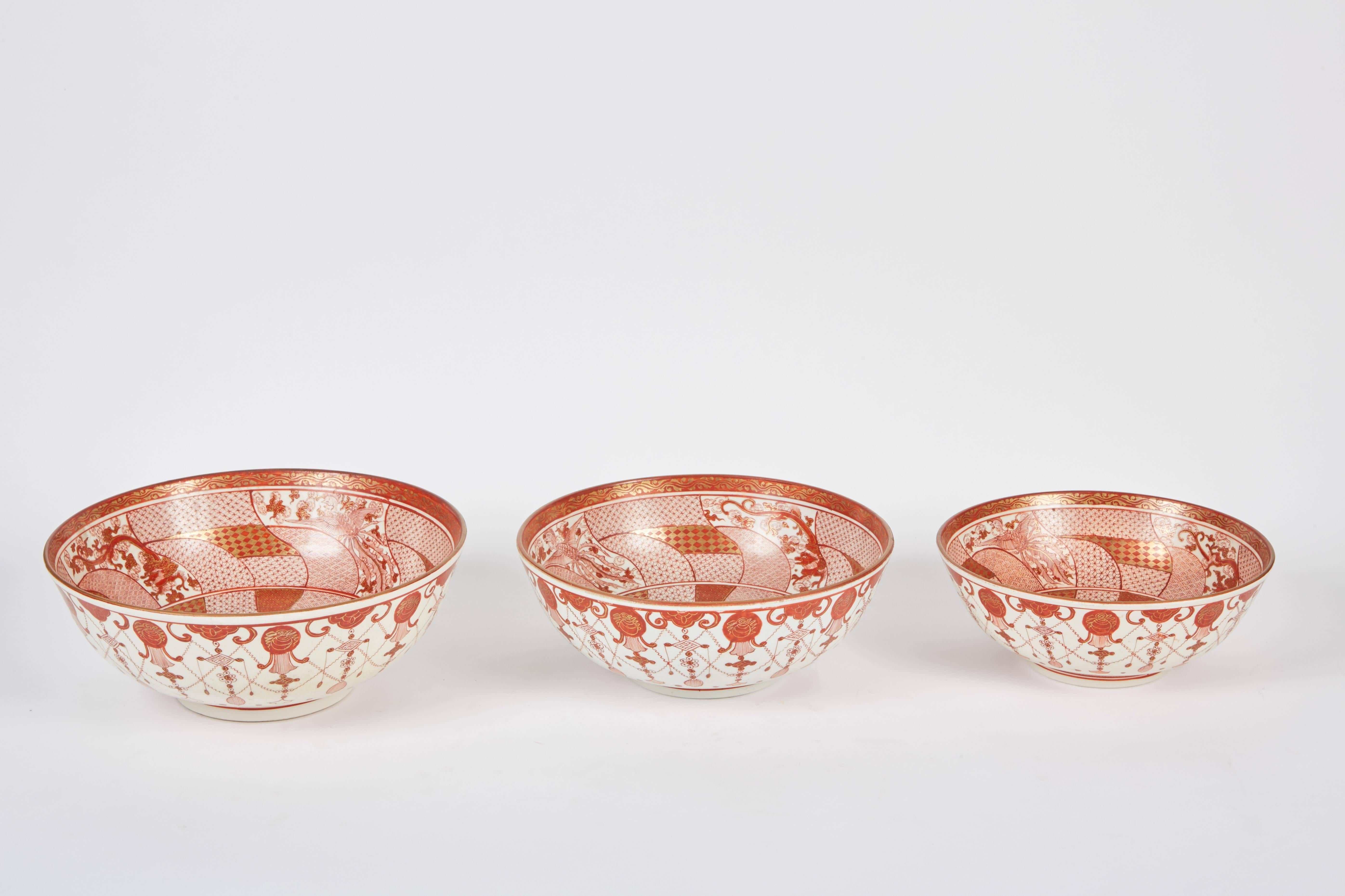 A set of three Kutani Japanese bowls in the Eiraku style, which is in contrast with the Yoshidaya style. The Eiraku style is a type of design technique where there is a gold coating on top of the original red color. Each one of these bowls has the