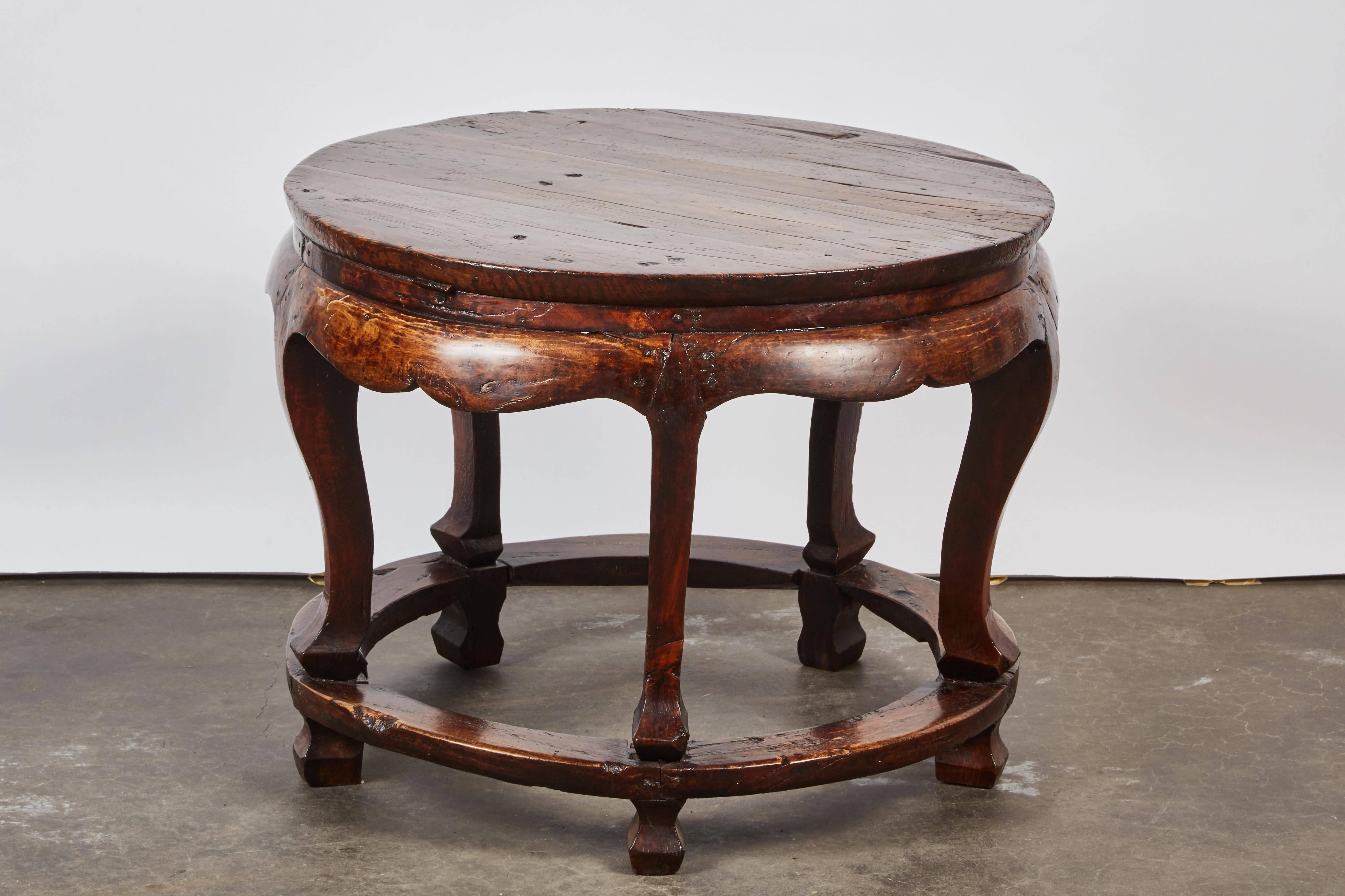 An extremely rare low round table from the Qing dynasty with original finish and is originally from Shanxi, China.