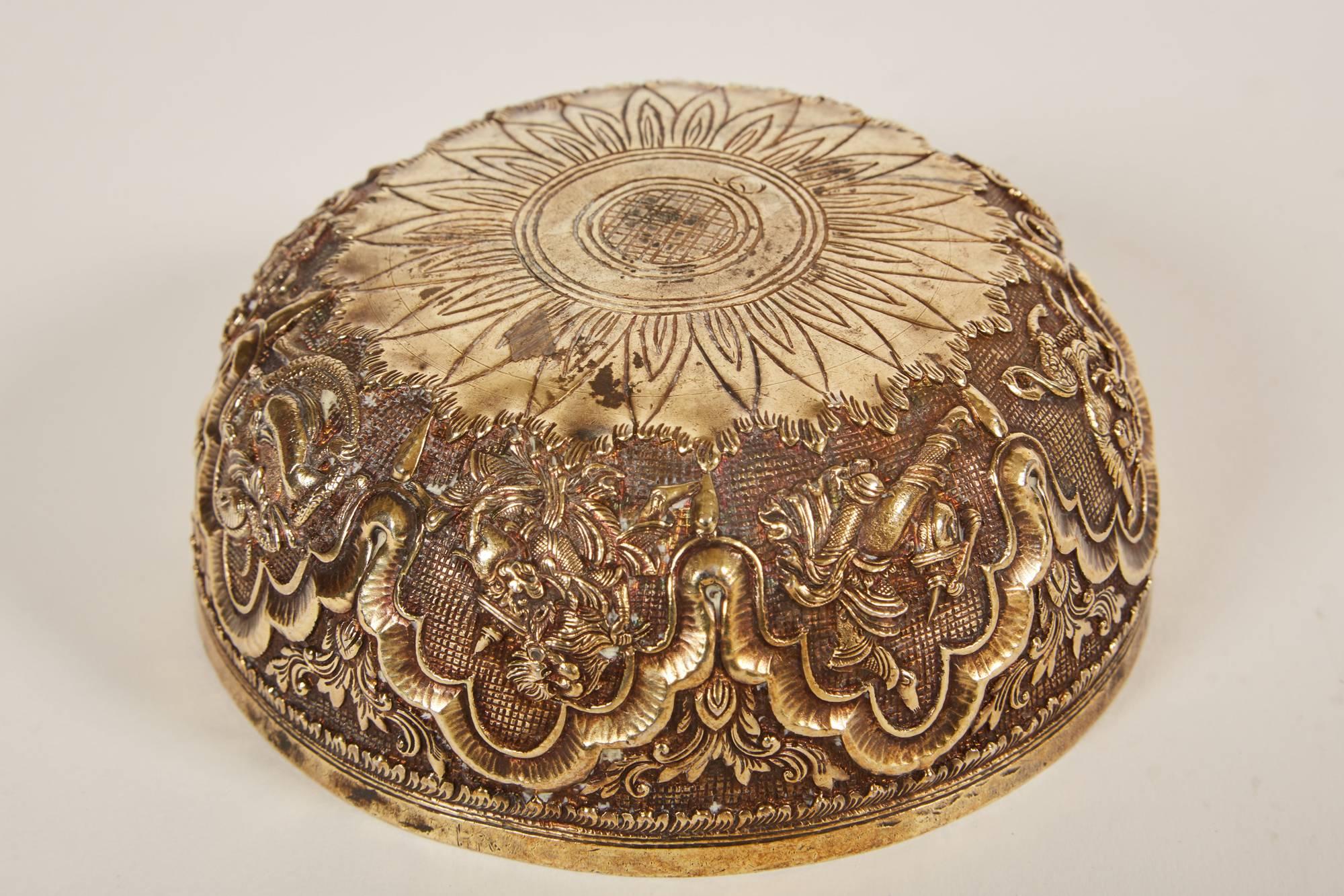 A stunning small 20th century Indian silver bowl in the Anglo-Raj style. The bowl is comprised of mythical creatures, foliage and Classic Indian motif relief.