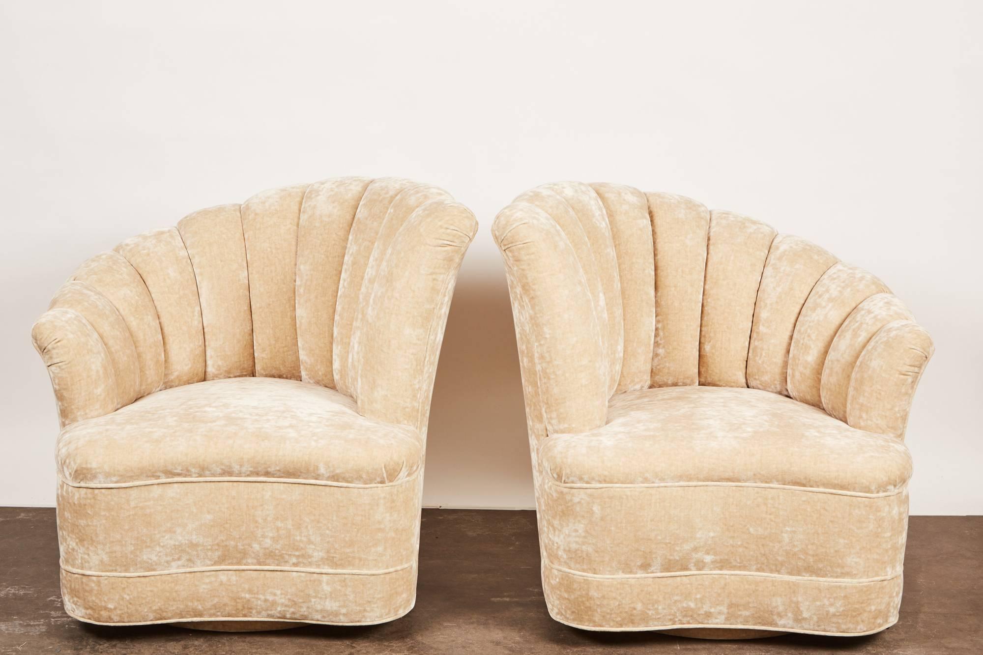 A pair of newly upholstered club chairs, inspired by the Nautilus marine mollusk while maintaining the Classic Art Deco style.