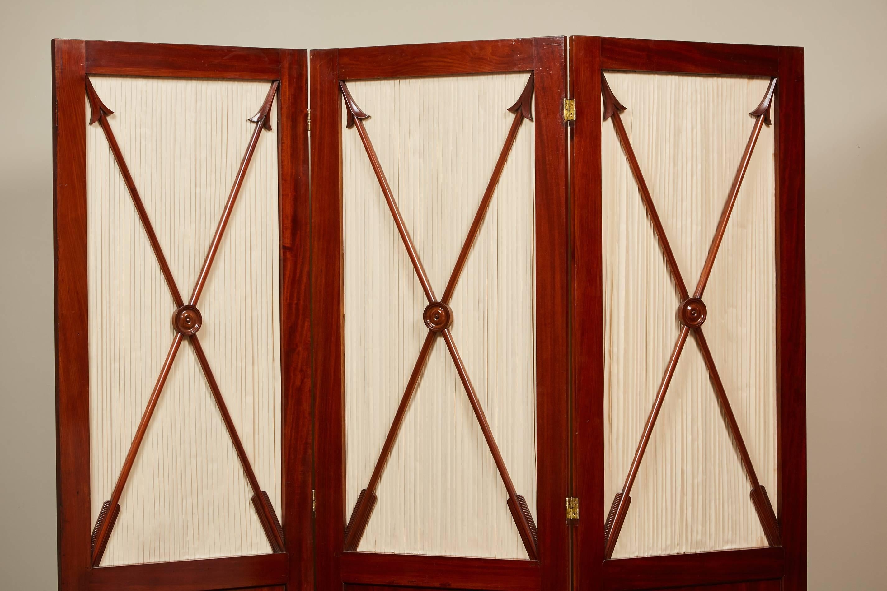 Three-Panel English Regency Mahogany screens. Double hinged featuring arrows with fabric backing over a solid mahogany panel.

  