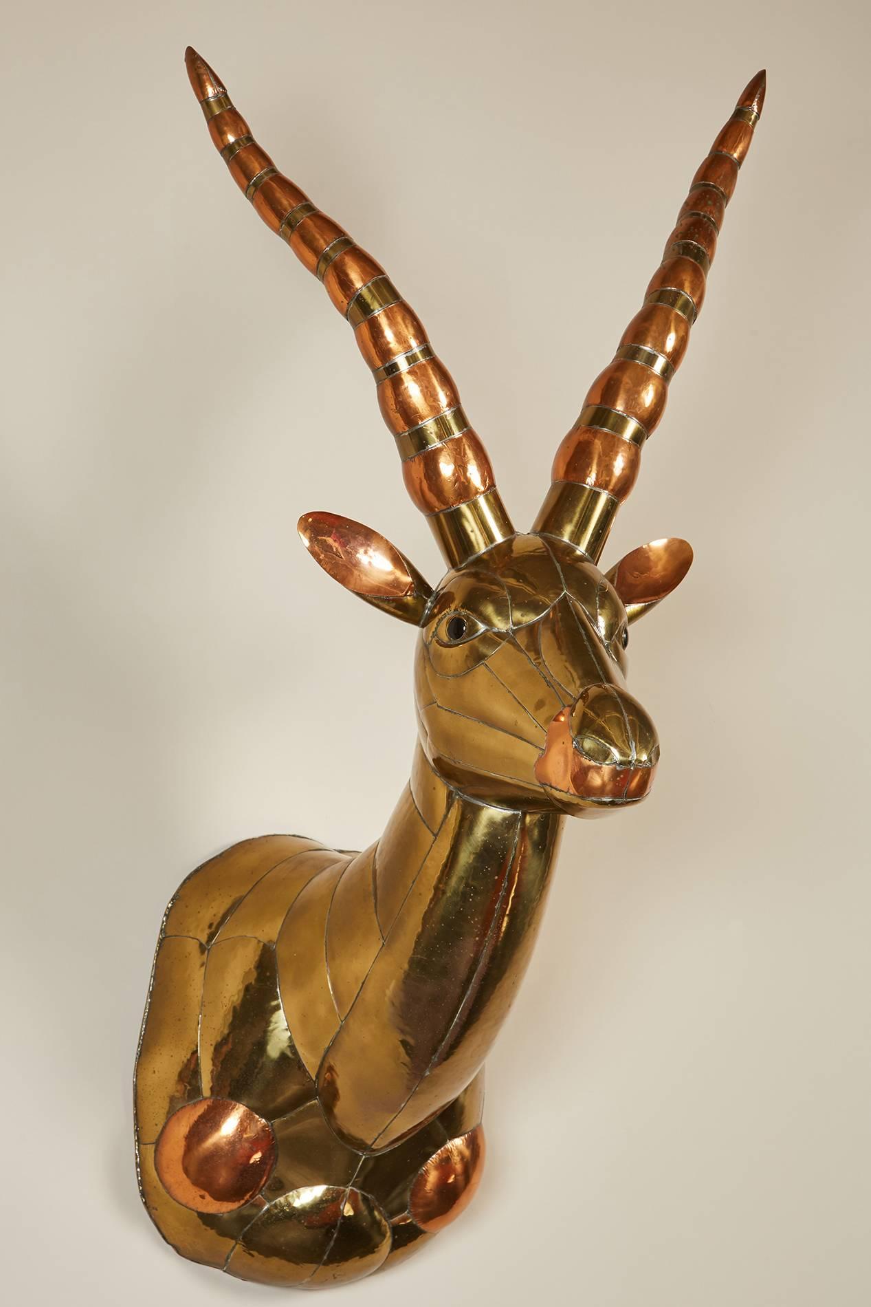 A Sergio Bustamante Antelope head comprised of mixed brass and copper.