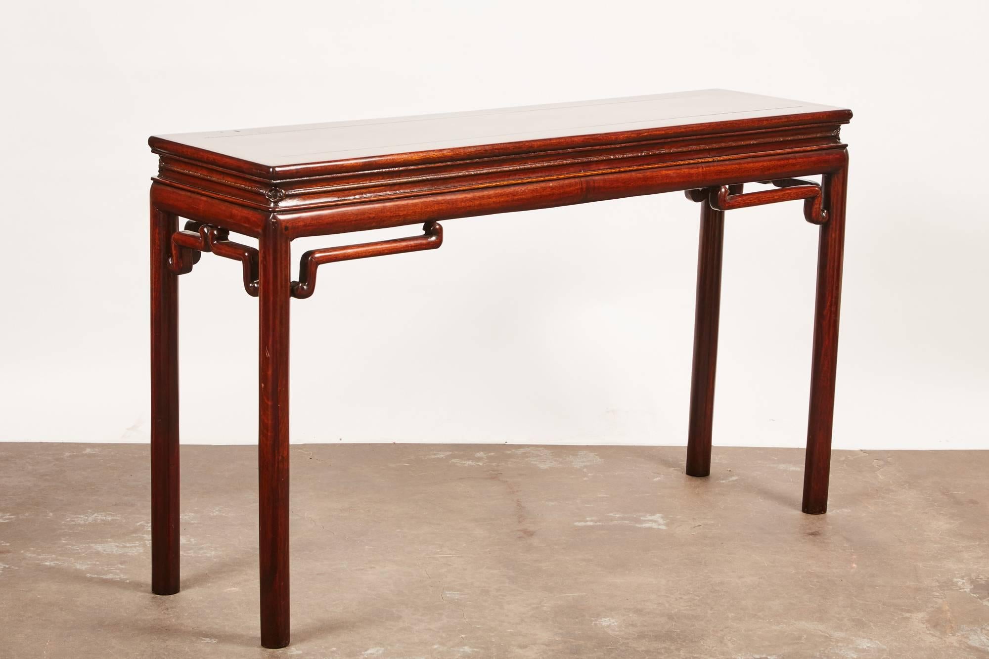 19th century rosewood altar table with delicate elbow braces.