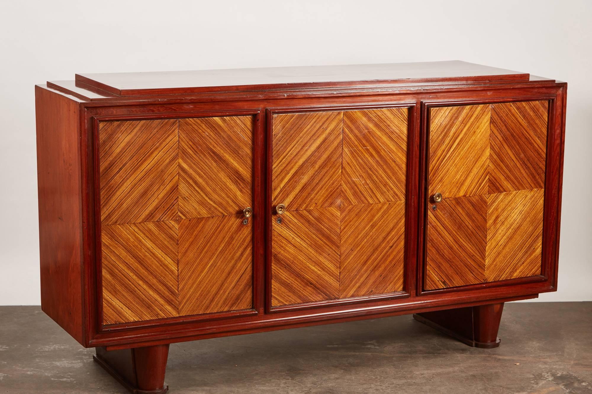 20th century French Colonial Vietnamese Art Deco rosewood sideboard. Three parquetry inlaid doors. The center compartment has a single drawer. Locks and catches are original but pulls are replaced.