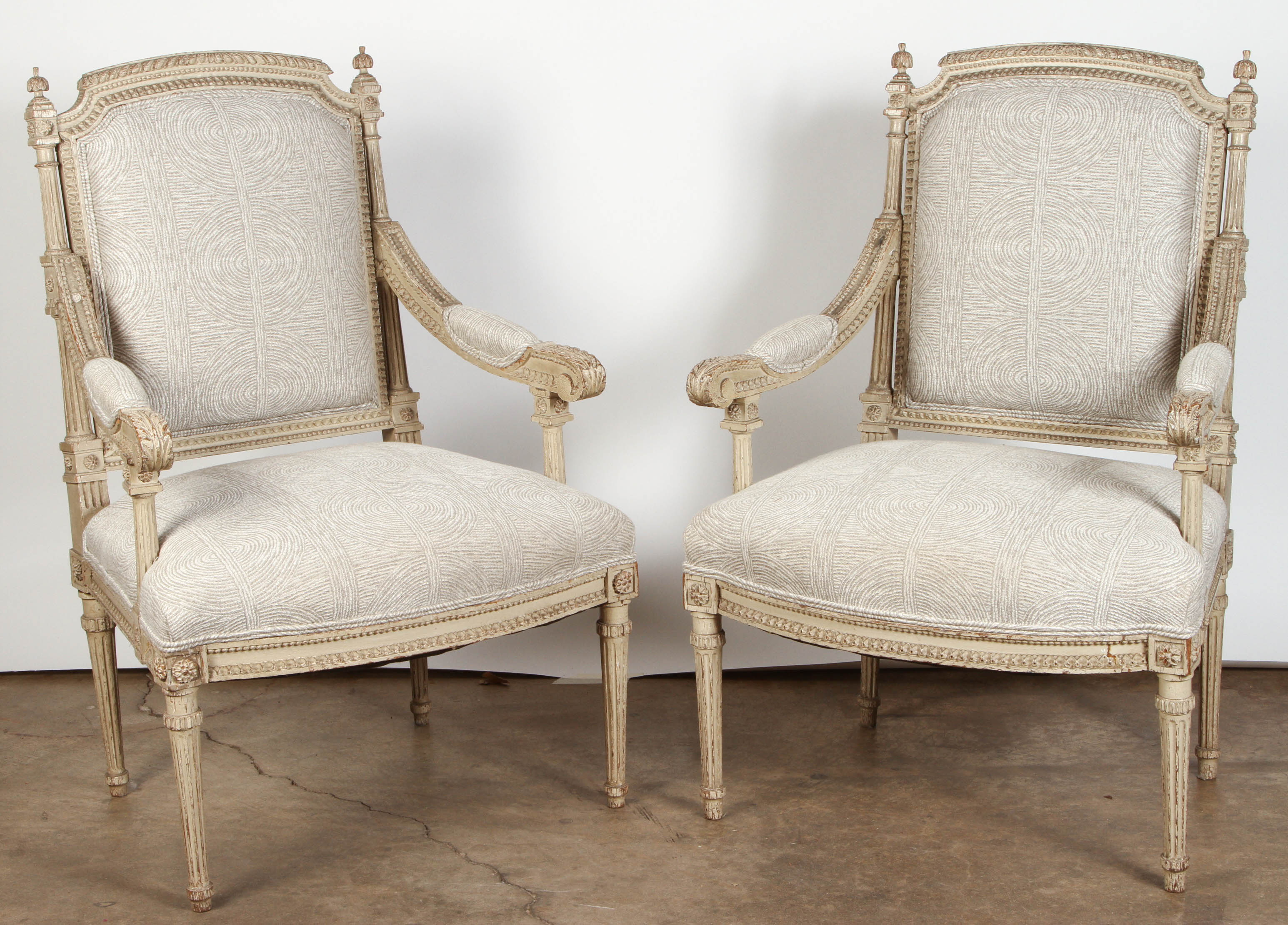 Pair of French Carved Louis XVI Armchairs