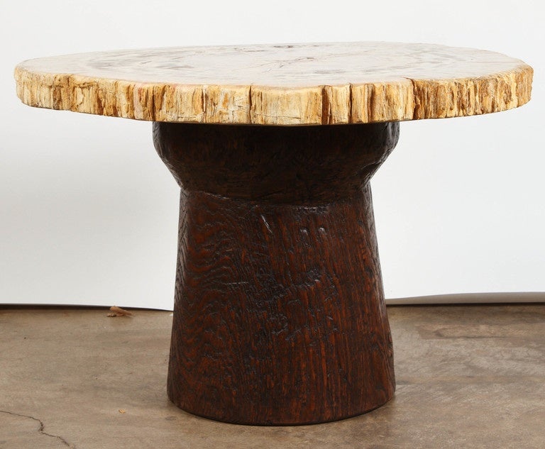 Assembled table of slab Petrified wood on an early teak base.