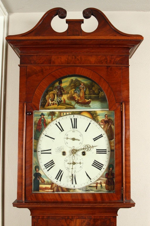 A longcase, or grandfather, clock, by A.Breckenridge of Scotland, circa 1825. Surrounding the face are illustrations of fashionable ladies of the early 19th Century in different modes of dress, perhaps meant to be illustrations of different seasons