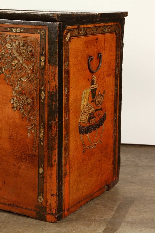 An 18th Century lacquered storage trunk, in a deep golden yellow color, decorated with painted vases, illustrating a story about 