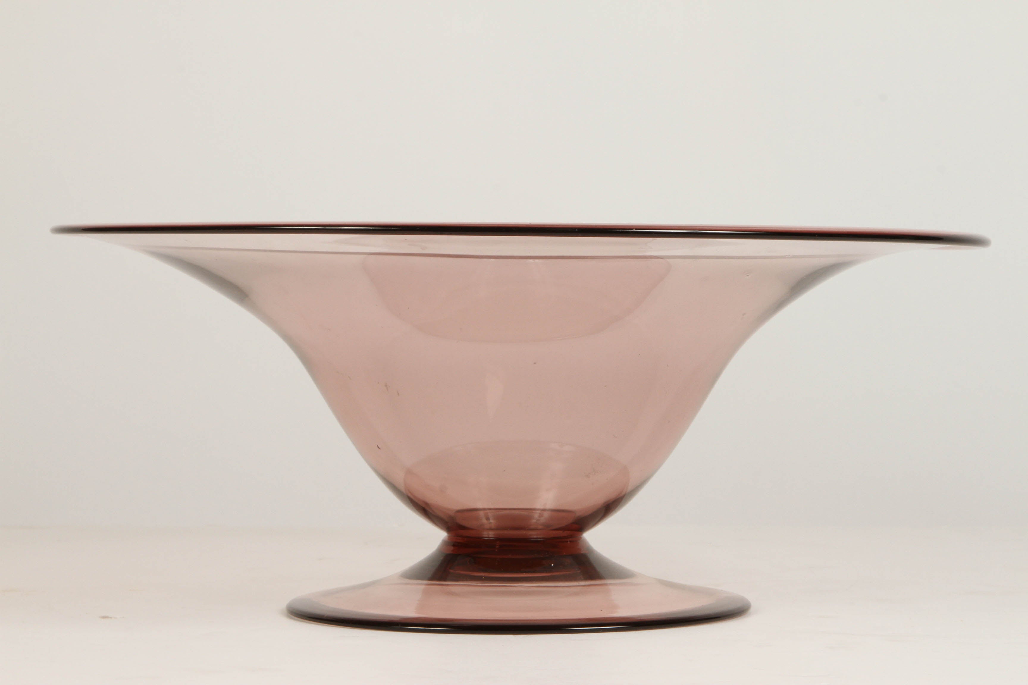 A beautiful light purple footed base glass bowl by Danish designer Jacob Bang, circa 1950.