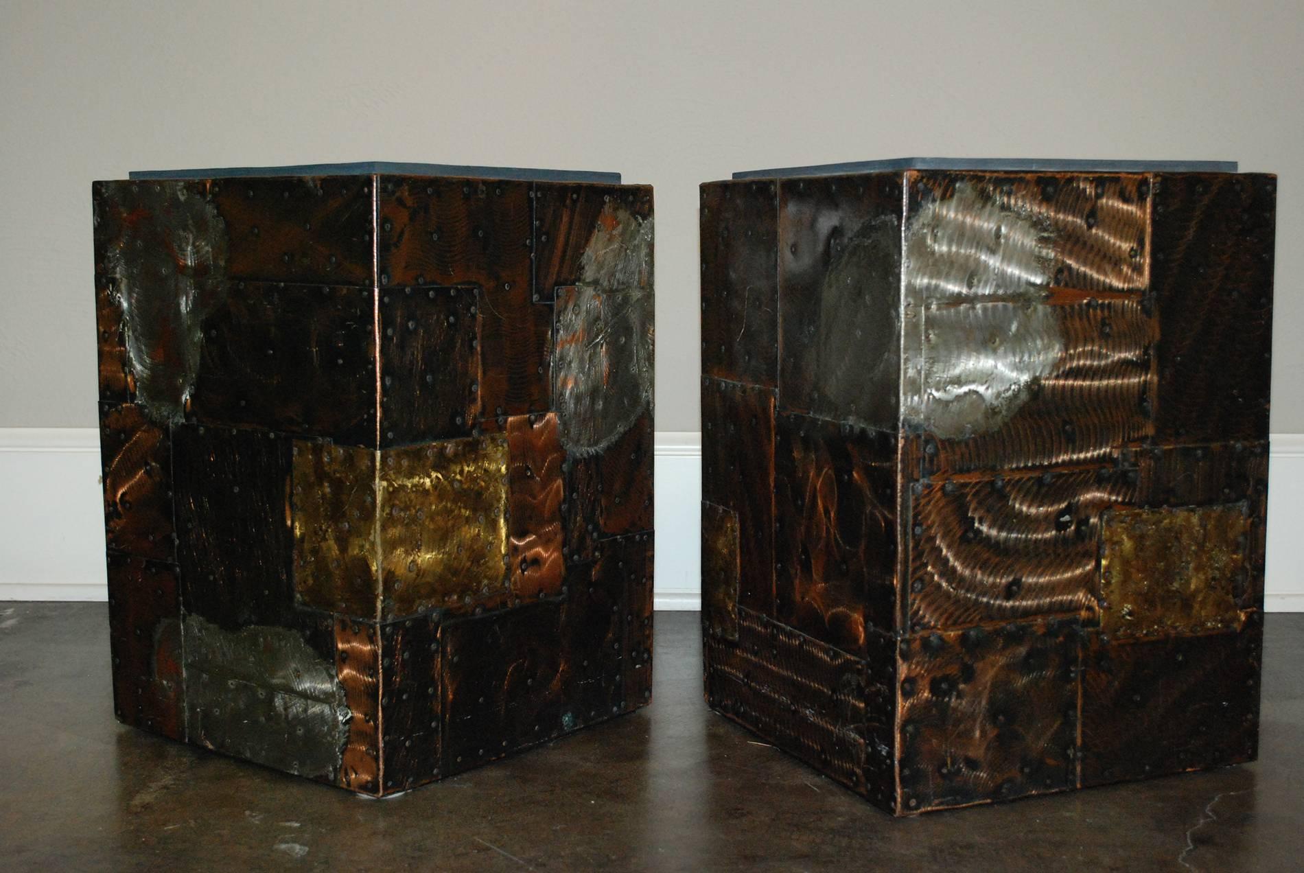 A pair of stunning Mid-Century Modern Paul Evan’s patchwork and slate cube side tables that features his unique and iconic welding techniques, as well as a well-fitted slate top. A variety of rectangles divide each of the cubes’ sides, not only