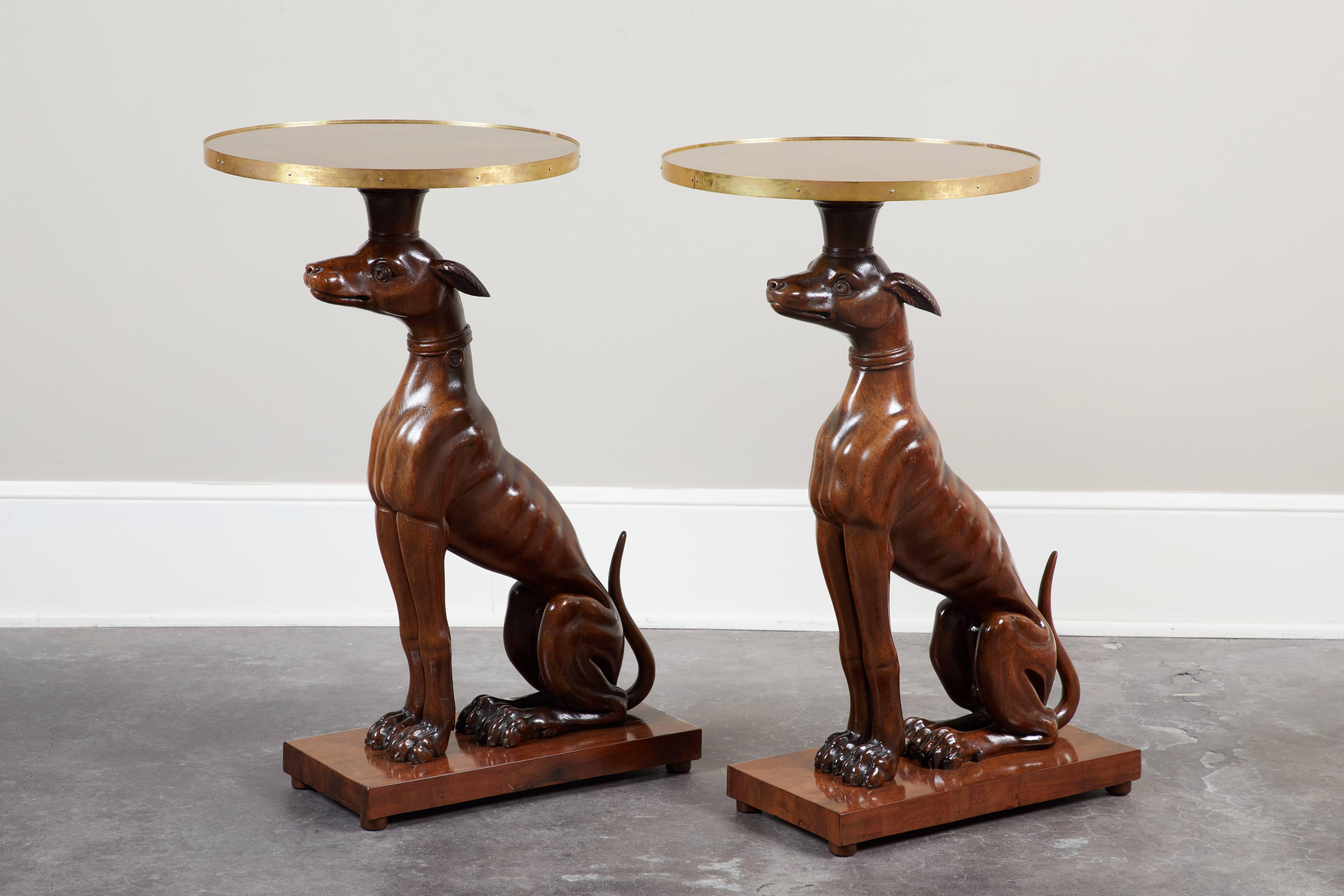 A pair of Italian mahogany greyhound side tables with newer base and top, circa 1840.