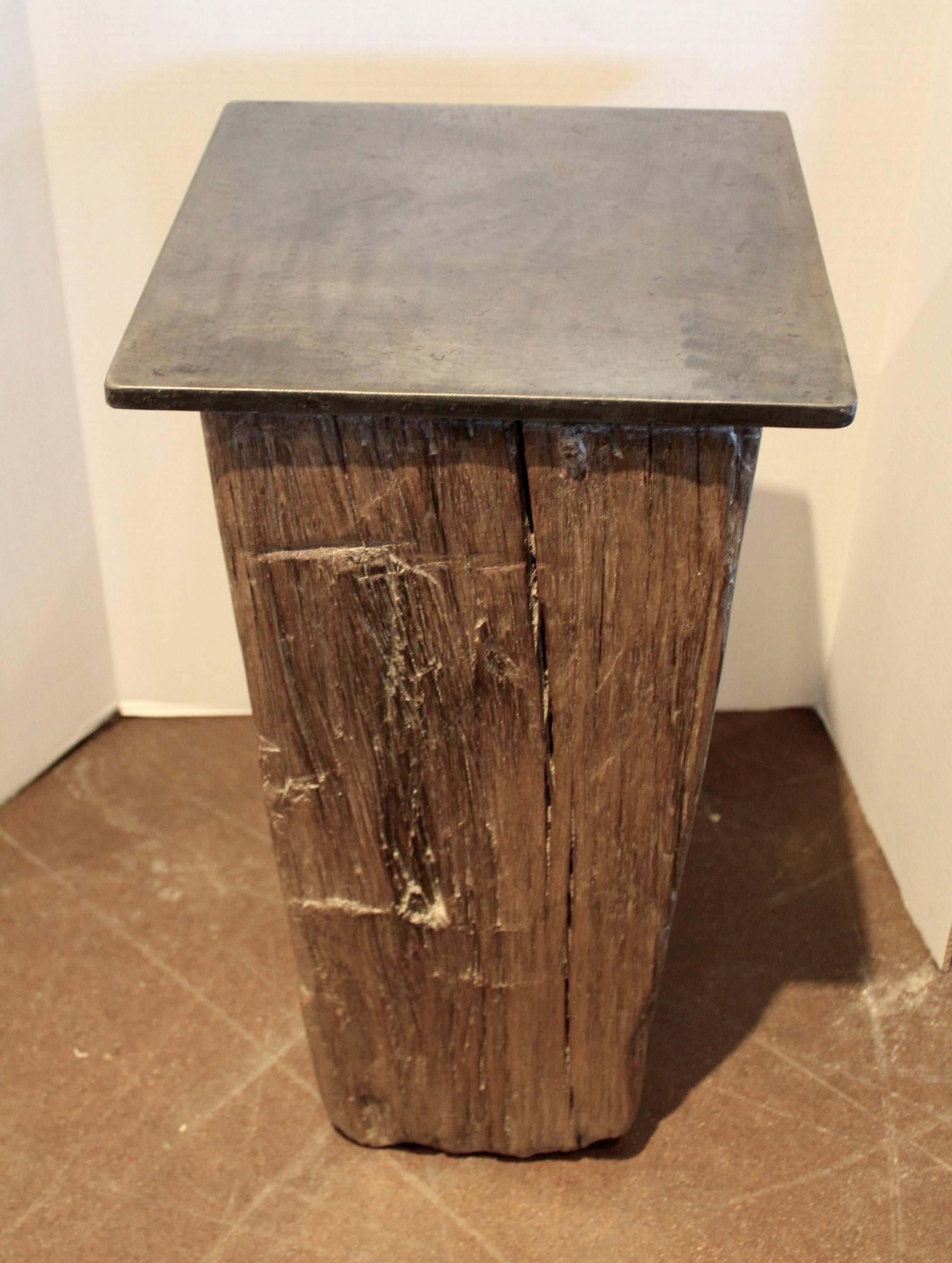 Dutch teak side table.
Antique dutch canal block of teak wood with steel base top. 
Teakwood. 
Can be used indoor or outdoor in covered area. 

 