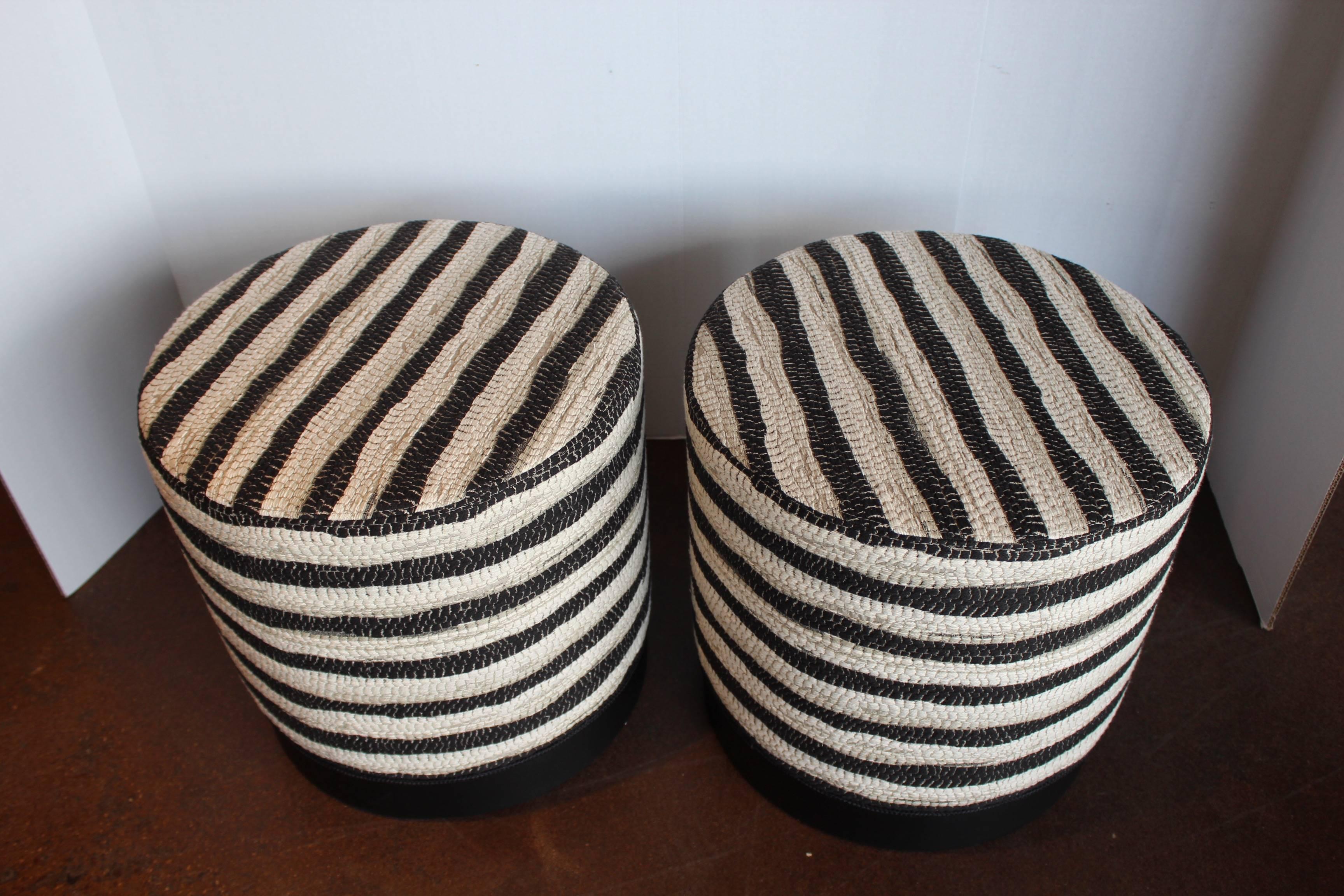 black and white, with hints of grey stripe ottomans.
Wesley hall ottomans.
Fabric: Baxter peppercorn.
 Black matte wood base.
 
Ottomans sold separately.