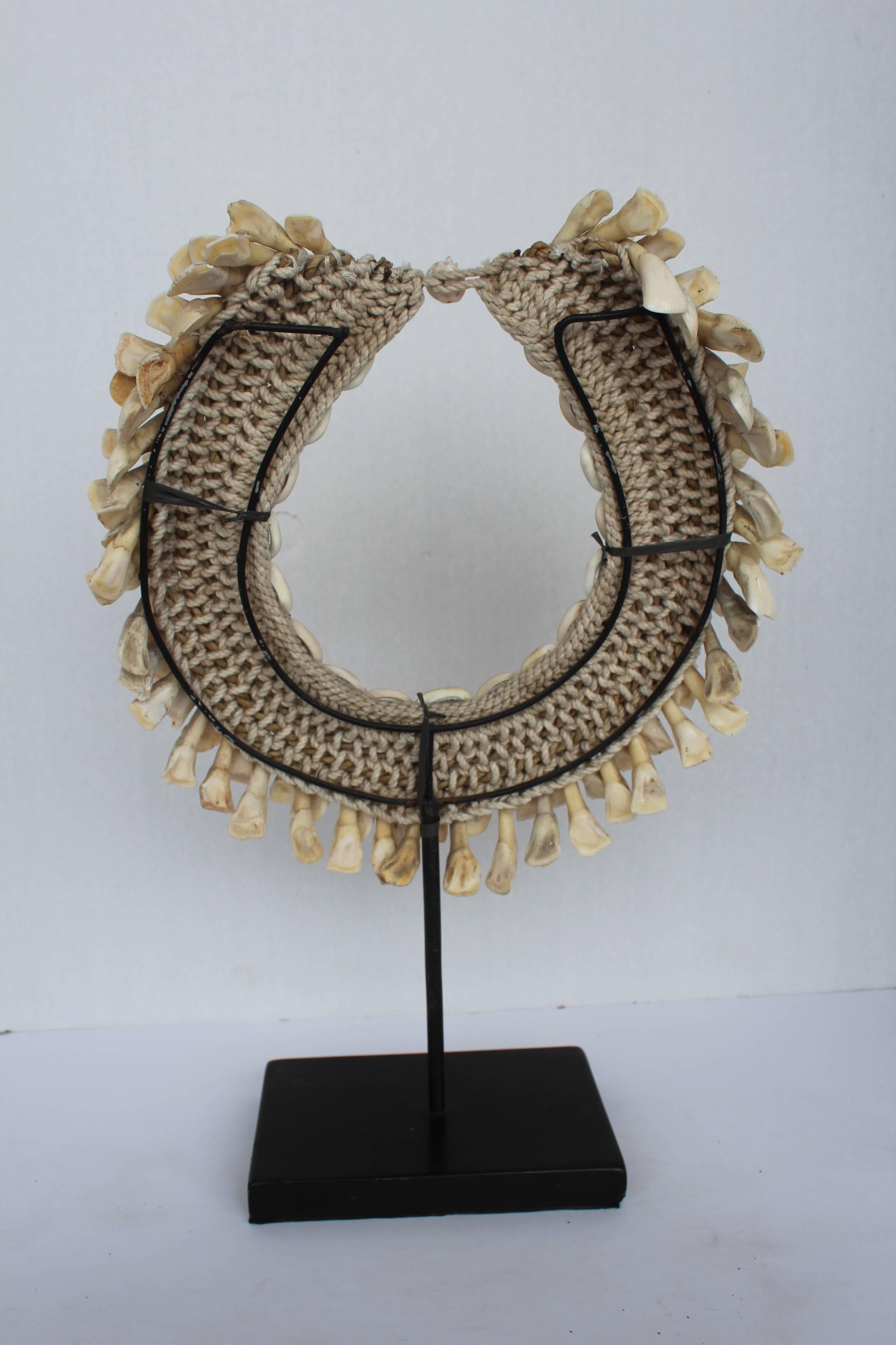 Mid-20th Century Tribal Teeth Necklaces on Stand