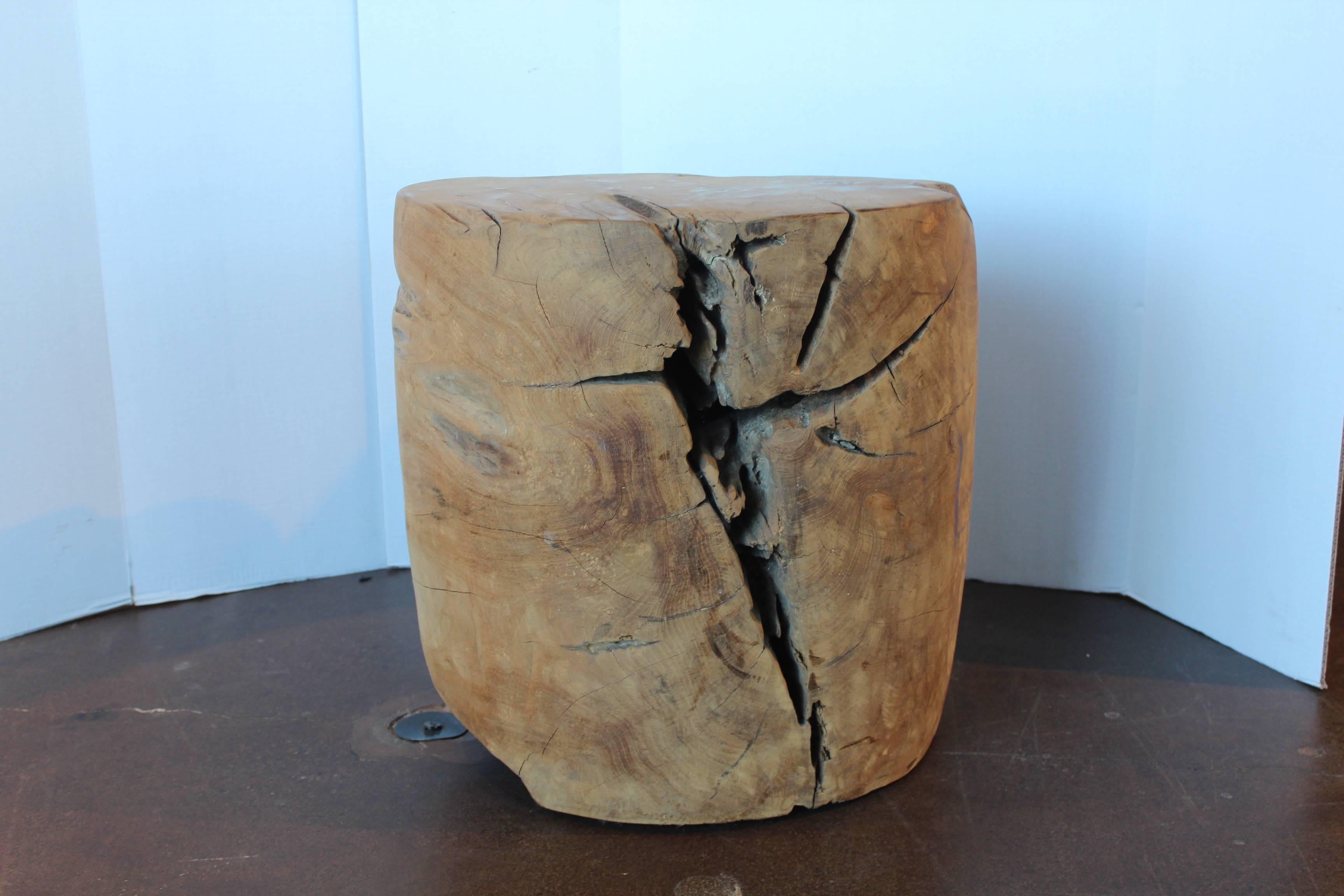 Solid organic teak end table.

Organic block teak a single reclaimed aged teak root. 
A perfect combination of modern and organic, with natural cracks to make a distinct end table. 

Can be used indoor or outdoor. 
If used outdoor, exposed to