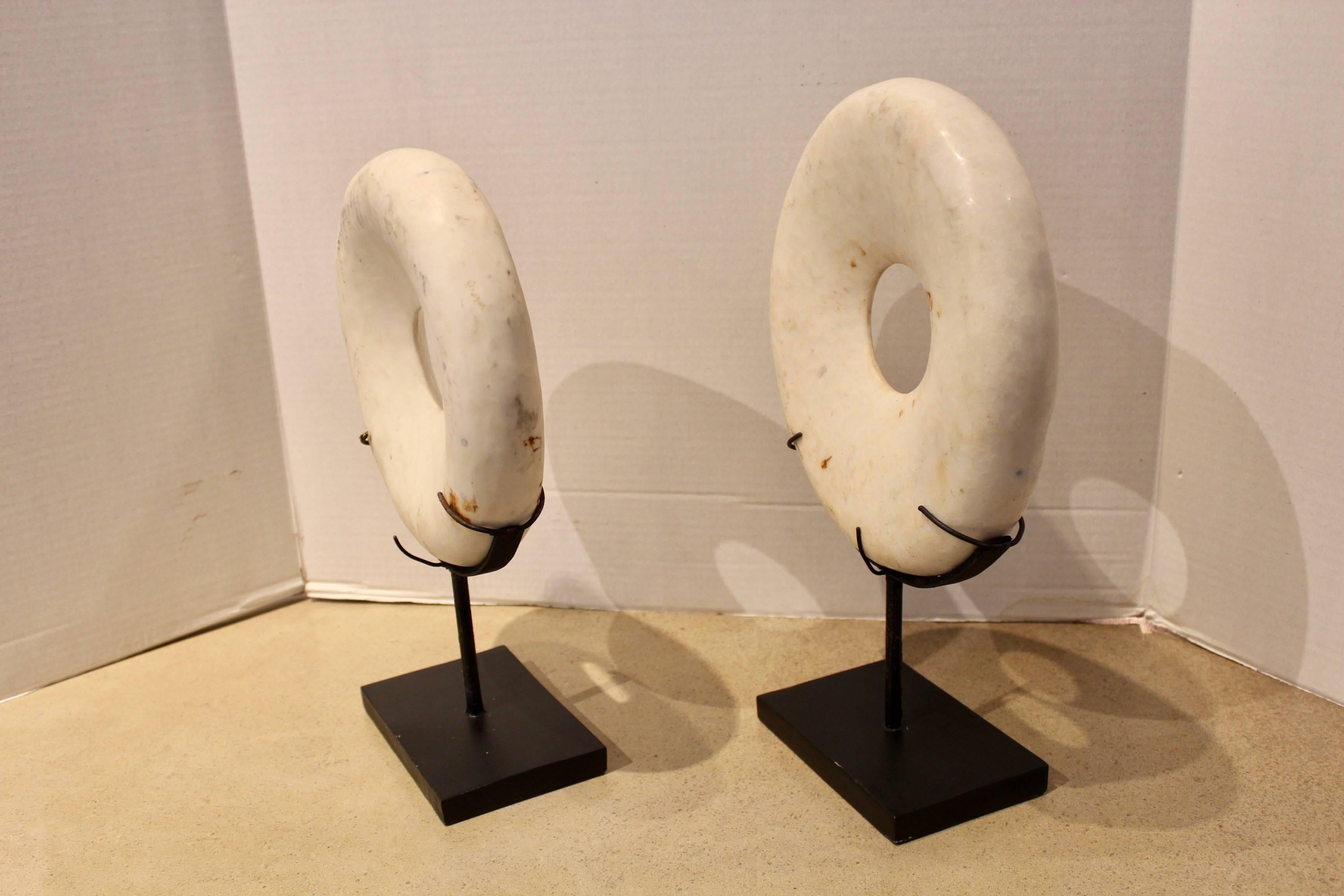 Vintage shell rings on stand.

These antique tribal shell rings are carved from a pacific claim shell and was once use as a currency exchange is now used for decorative art!

Using a traditional technique by grinding with sand and a bamboo