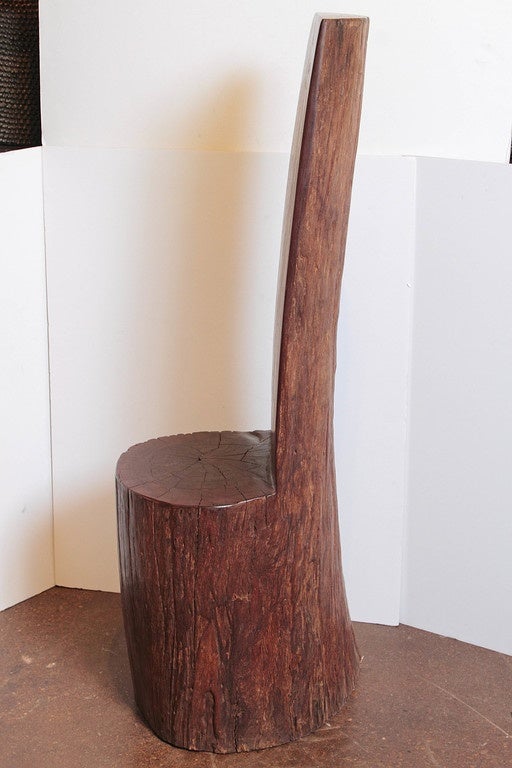 Splinter-free, with natural grains of appearance of deep reddish brown coloration. Clear coat wax was used to enhance natural shine and smoothness. Rendered in organic modern style, hand-carved into a unique ironwood tree stump chair.

This