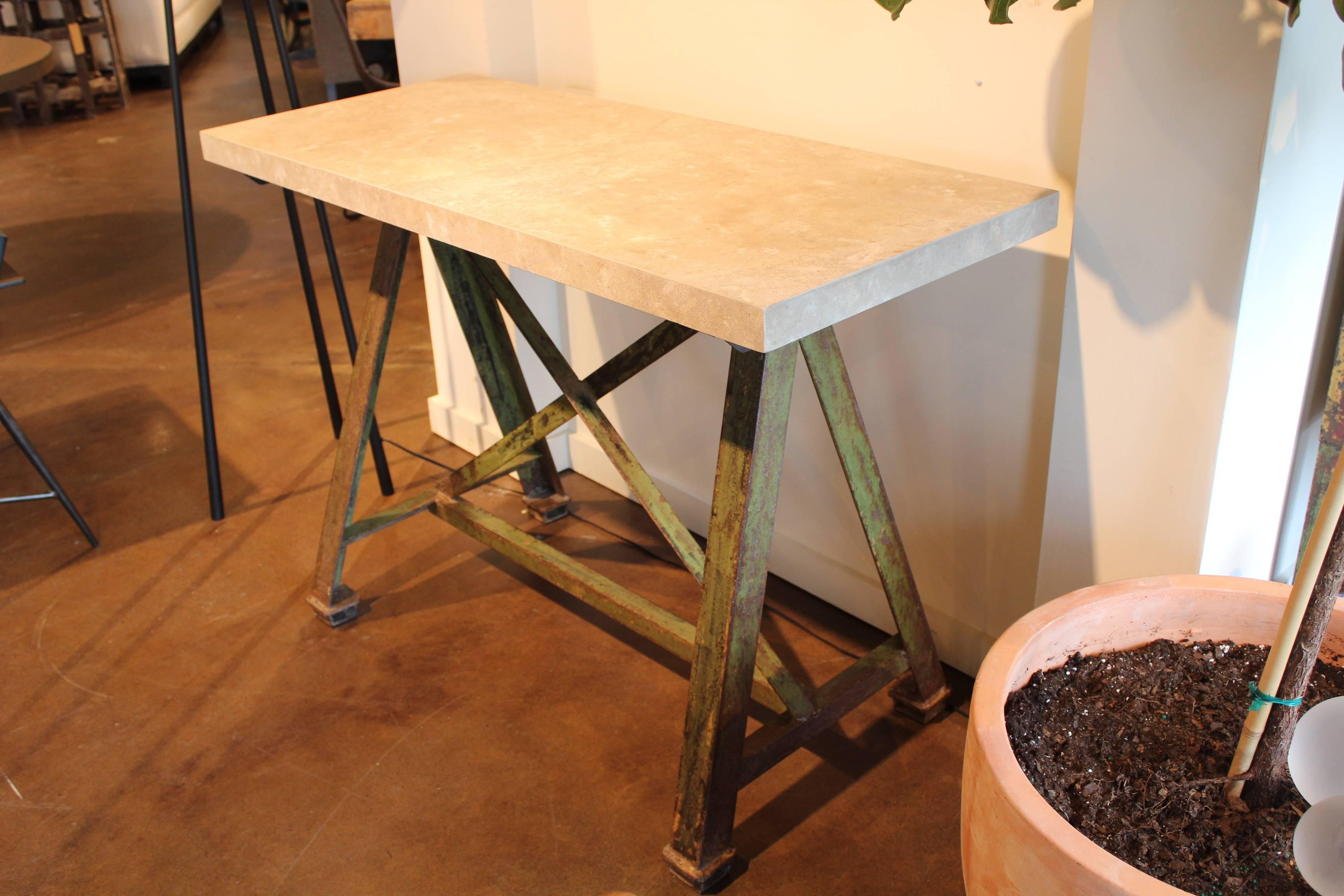 Original paint patina base re-purposed to hold vintage limestone top formerly used in French bakery.