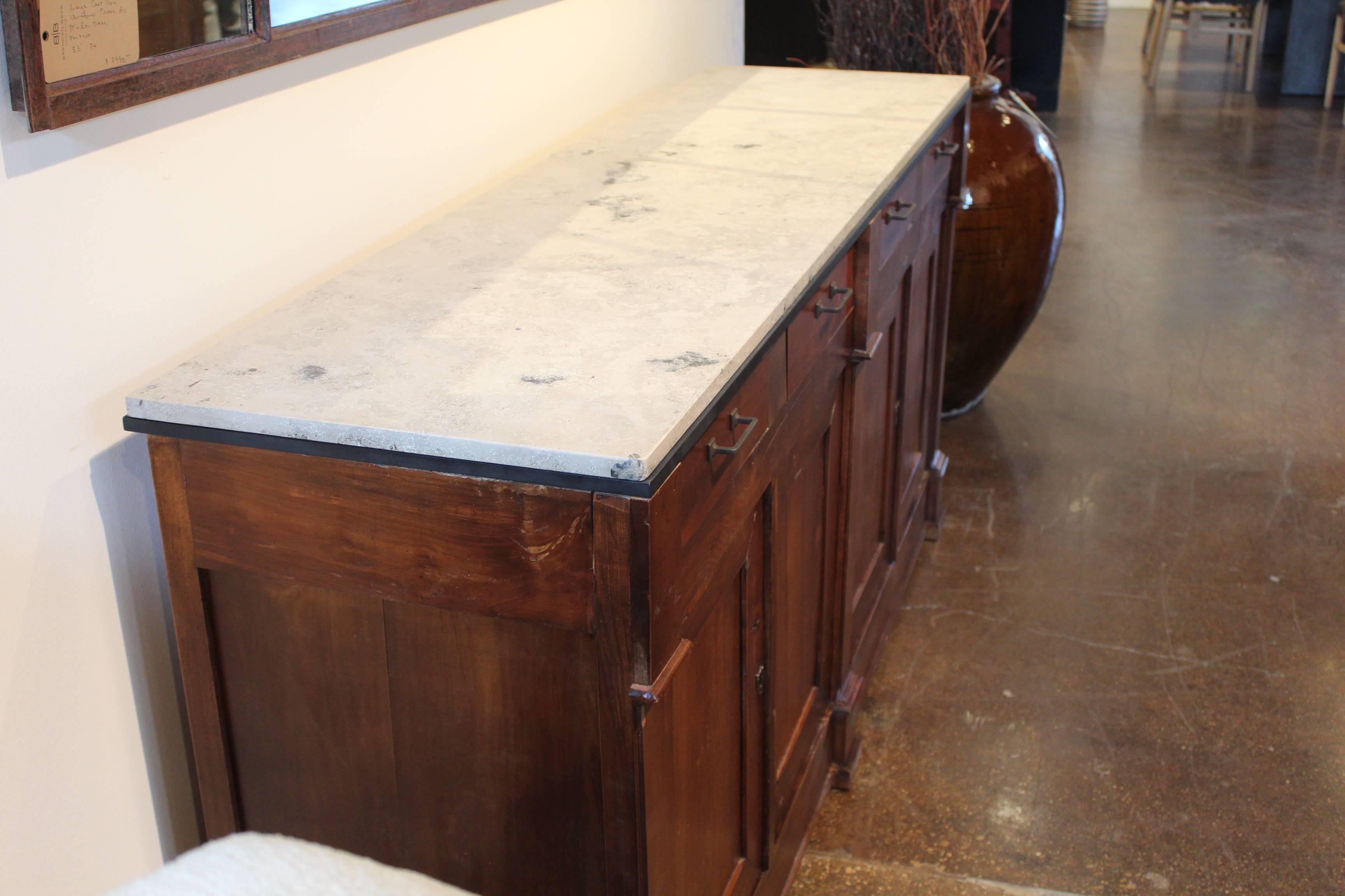Antique French cherrywood Enfilade with honed limestone top.
Paris, circa 1930.