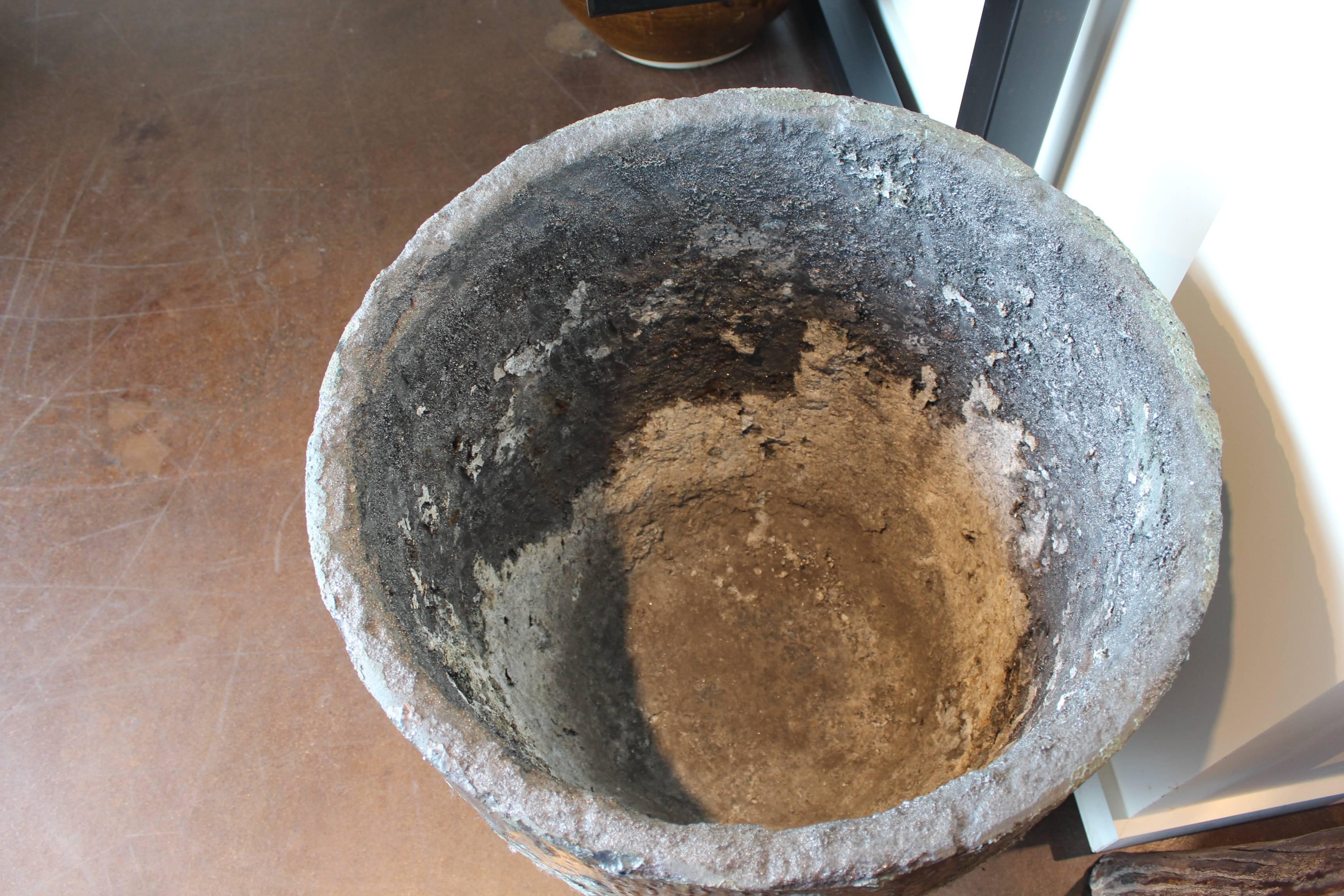Vintage crucible used in Industry for molten metals. Use could be as side table, or planter. Interior has a 