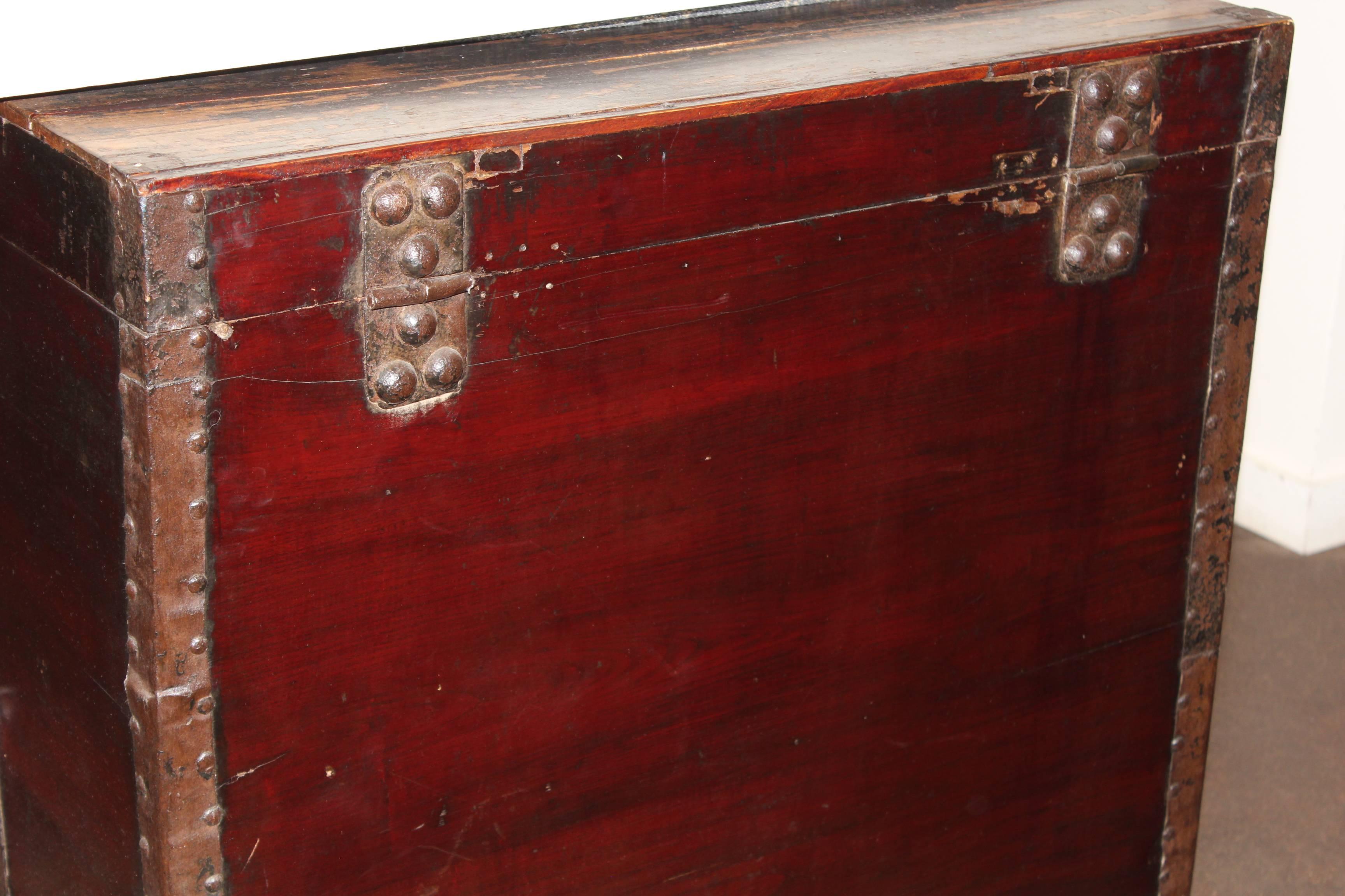 Antique elm travel trunk with original hardware.