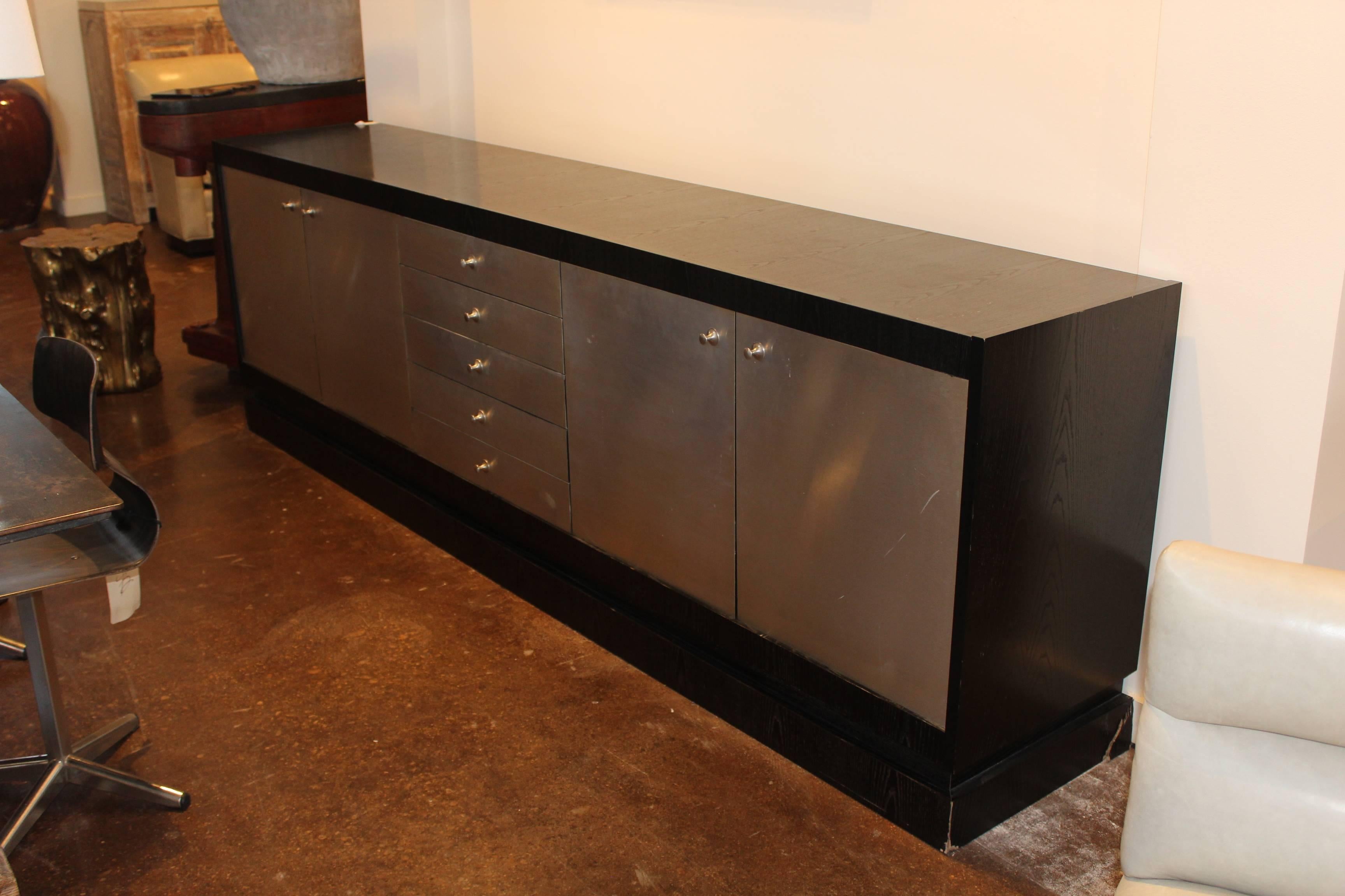 Ebonized French oak Mid-Century server with brushed stainless steel on doors and drawers.