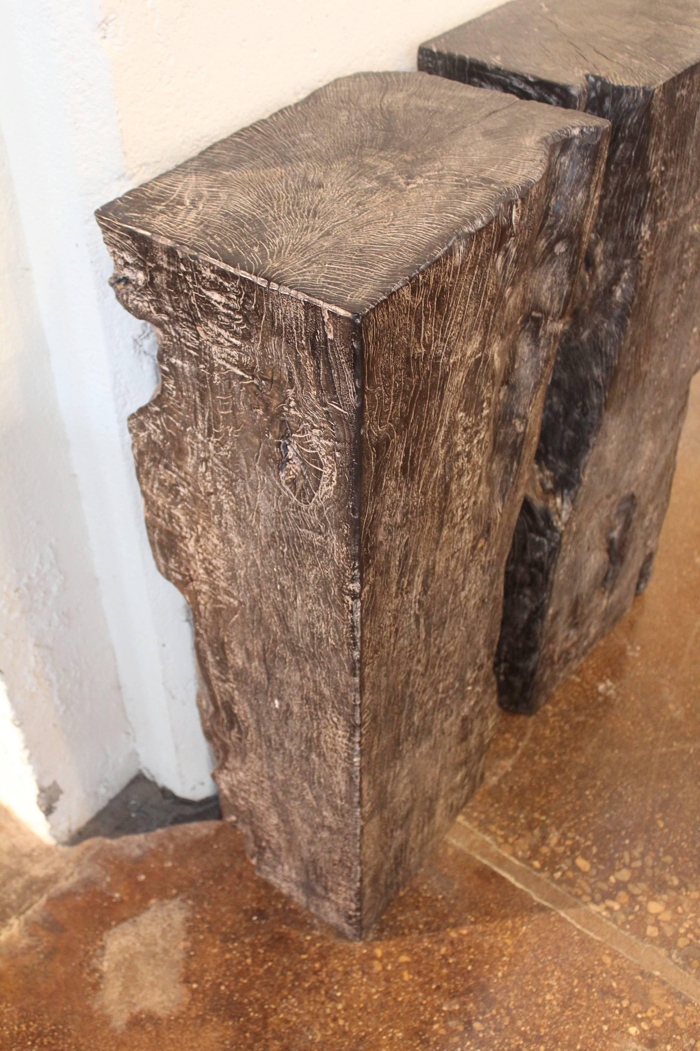 Ebonized Lychee wood beam segment as pedestals.